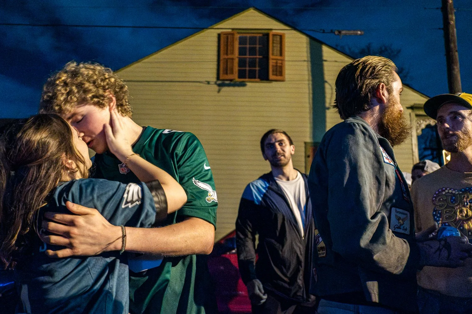 A young couple kisses in the street outside Markey’s Bar in New Orleans as Eagles fans celebrate the Super Bowl win.