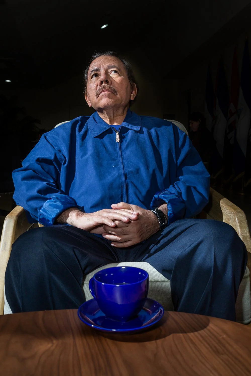Portrait of Daniel Ortega with teacup during meeting in managua.