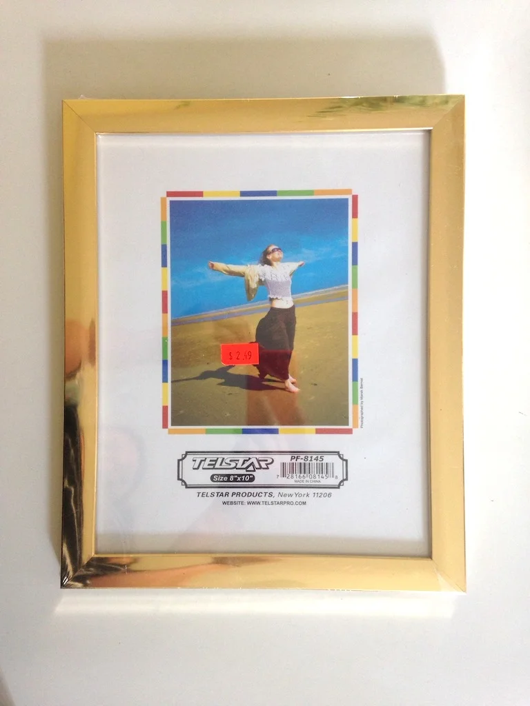The lady in the frame is sure enjoying her walk on the beach. I should have loaded up on these before I left Brooklyn. The dollar store (where everything is over $2) down the street had cheap gold frames. They had sharp angled ones that looked modern and awesome. The one above is a little beveled for my taste, but will do just fine. 