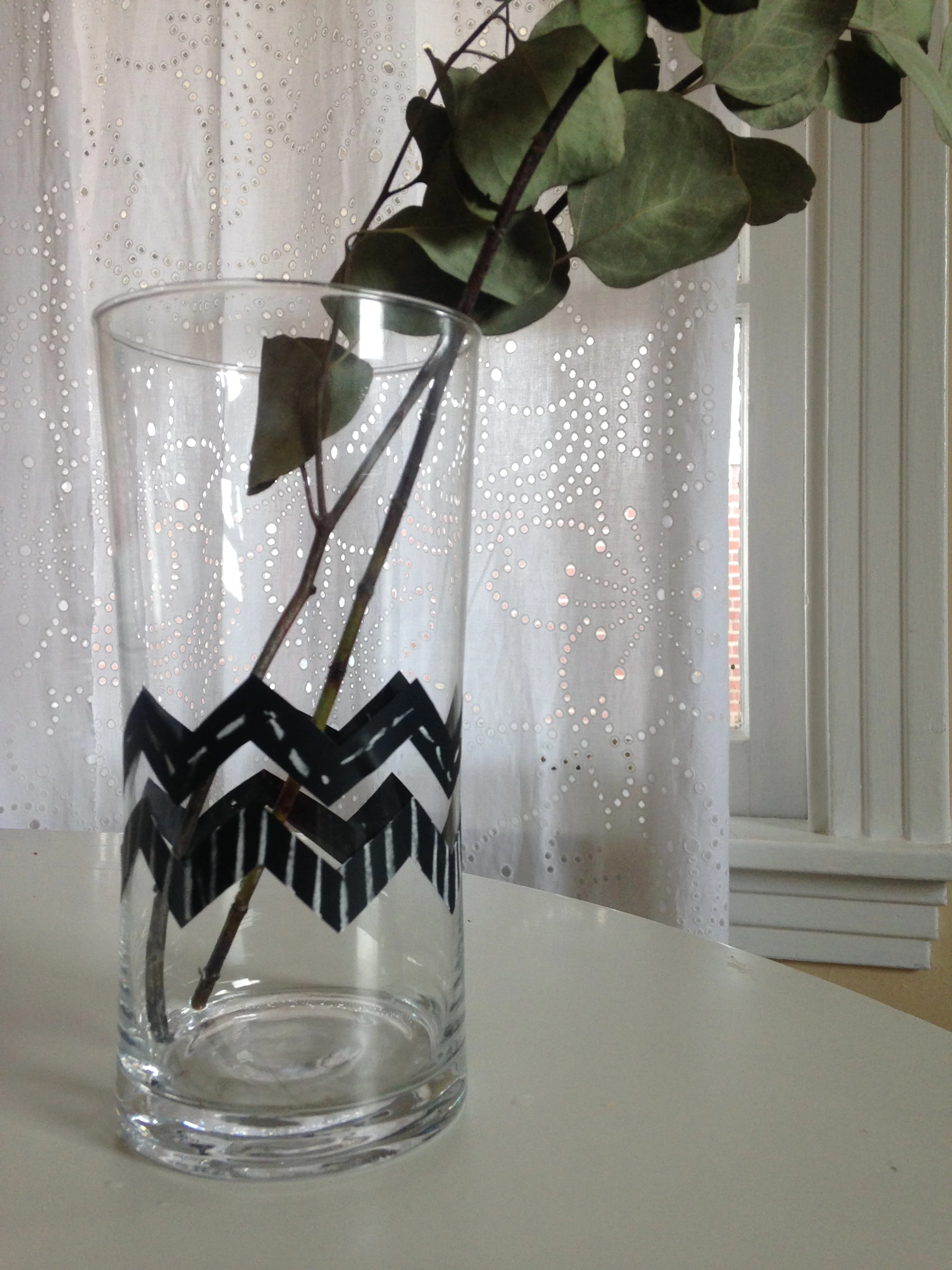 Ever need to doll up an existing vase or glass for something you're hosting? I do! You could do a million different designs using chalkboard tape. You could personalize vases with a name, note or quote. You could do a large scale design or even cut the tape in different designs. Lots of options with this one! 