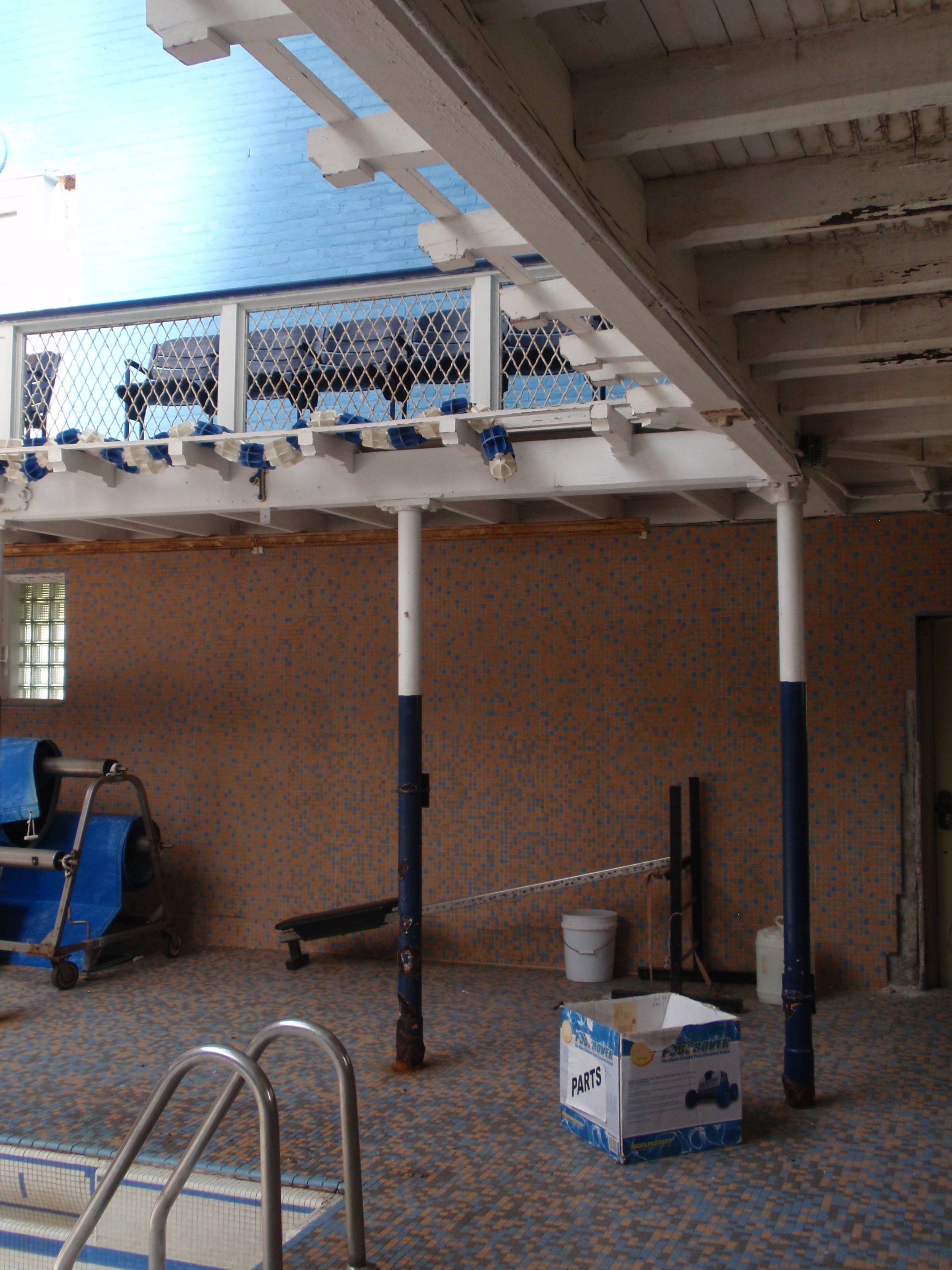  The edge of the pool, with spectator seating on the balcony above. 