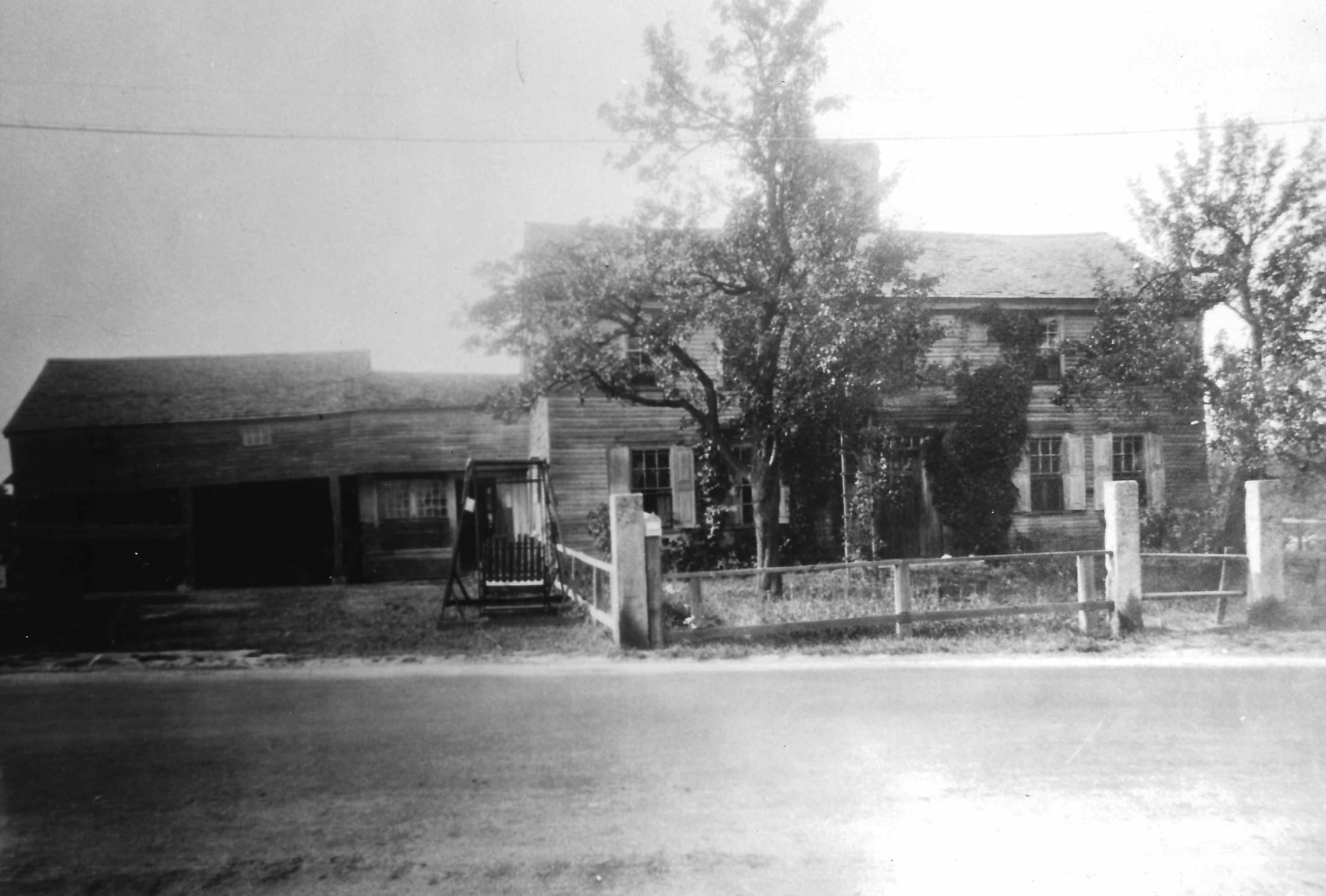 The photograph from the Hopkinton Public Library, labeled "Raftery Place - Toll House Family Home E. Main near Clinton 1706. Moved to N. J. & reblt."