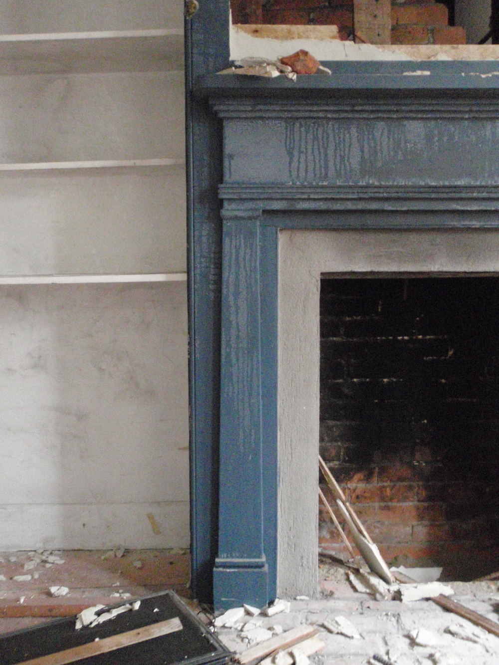  A detail of the fireplace in the parlor, which is more ornate than the one in the historic kitchen. 