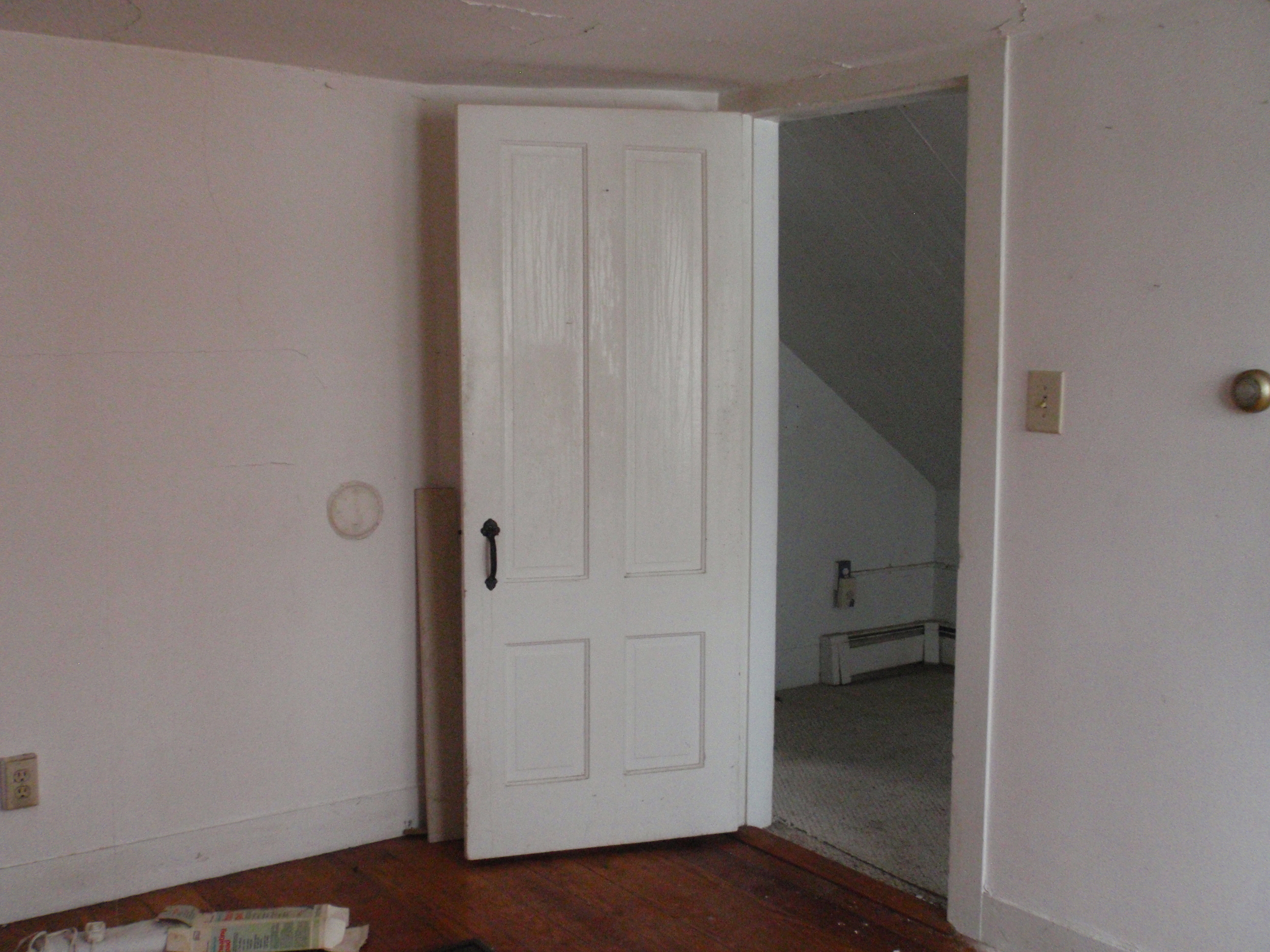  The east bedroom is the largest; looking from the bedroom into the upstairs hall. 