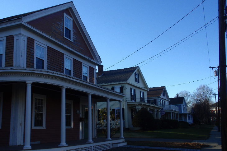 The opposite side of the street from the Spurr House is lined with mid-19th century end gable houses that were built to resemble a Greek Temple.