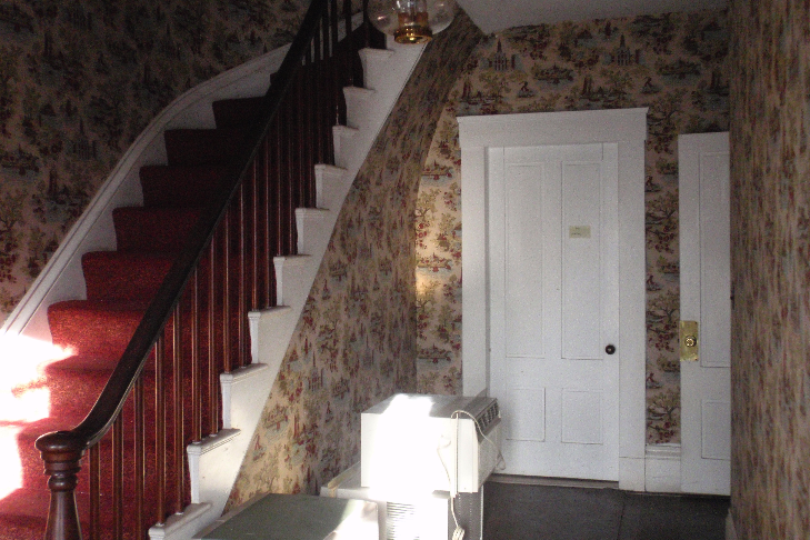  The main entry hall of the Spurr House was repapered in the 1970s. The paper is typical of patriotic designs that were common around the 1976 bicentennial. 