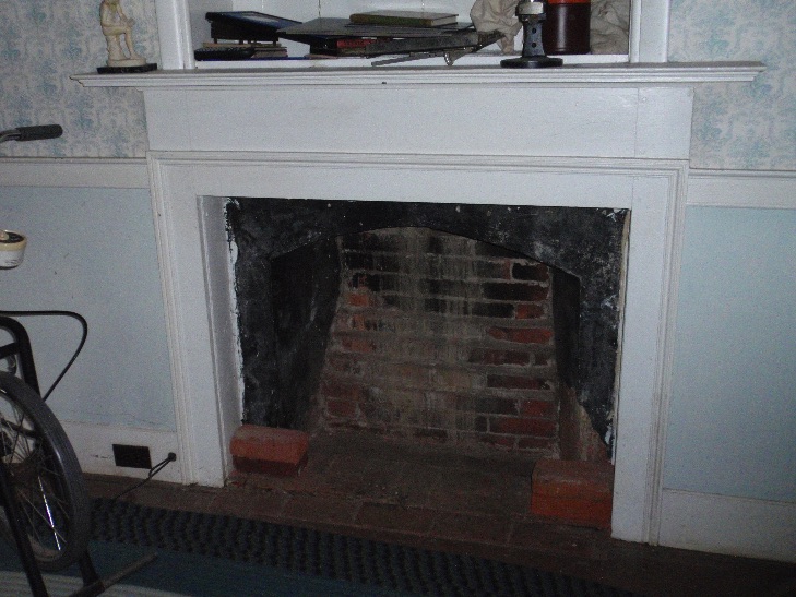 The Federal style fireplace in the east chamber