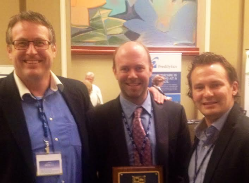 Stephen Tramontana (left) and Nick Weeks (right) of CHS with Doctor of the Year award recipient, Dr. Thomas Lally, at the 2014 AAHCM conference.