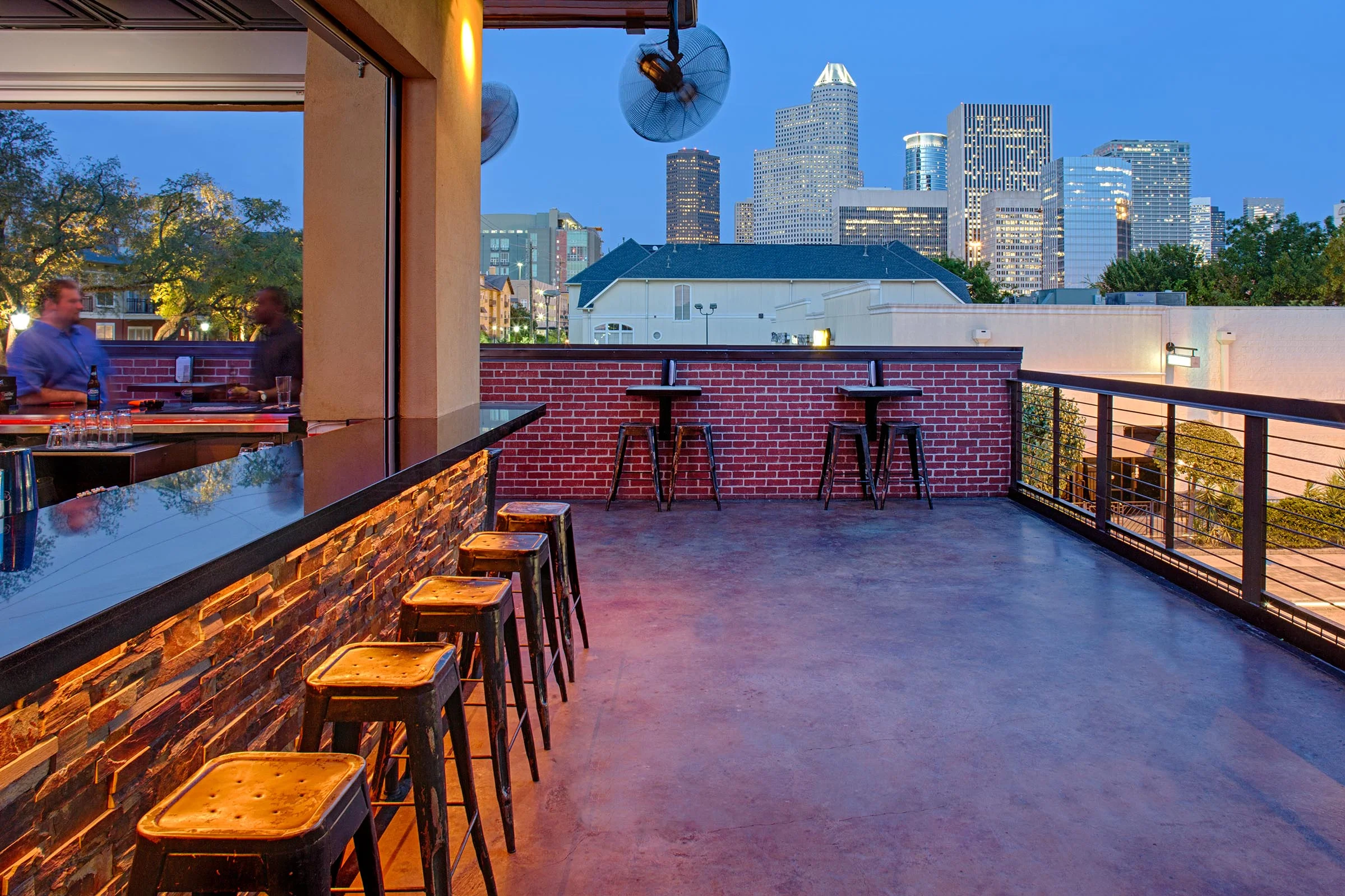 Quite often our bar and restaurant designs feature roof decks to get away from the heat and capture a view. (The Dogwood, Houston, TX)