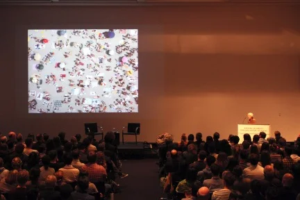 Image Caption: Denise Scott Brown delivers “Mayhew’s Architecture” at the Harvard Graduate School of Design in 2013. In a note to Scott Brown, Italian architect Carolina Vaccaro wrote that the Petition is “the worldwide acknowledgment that your outsider ideas and research are still (and will be for a long time) the best source any architect can have!” Image Credit: Beth Roloff