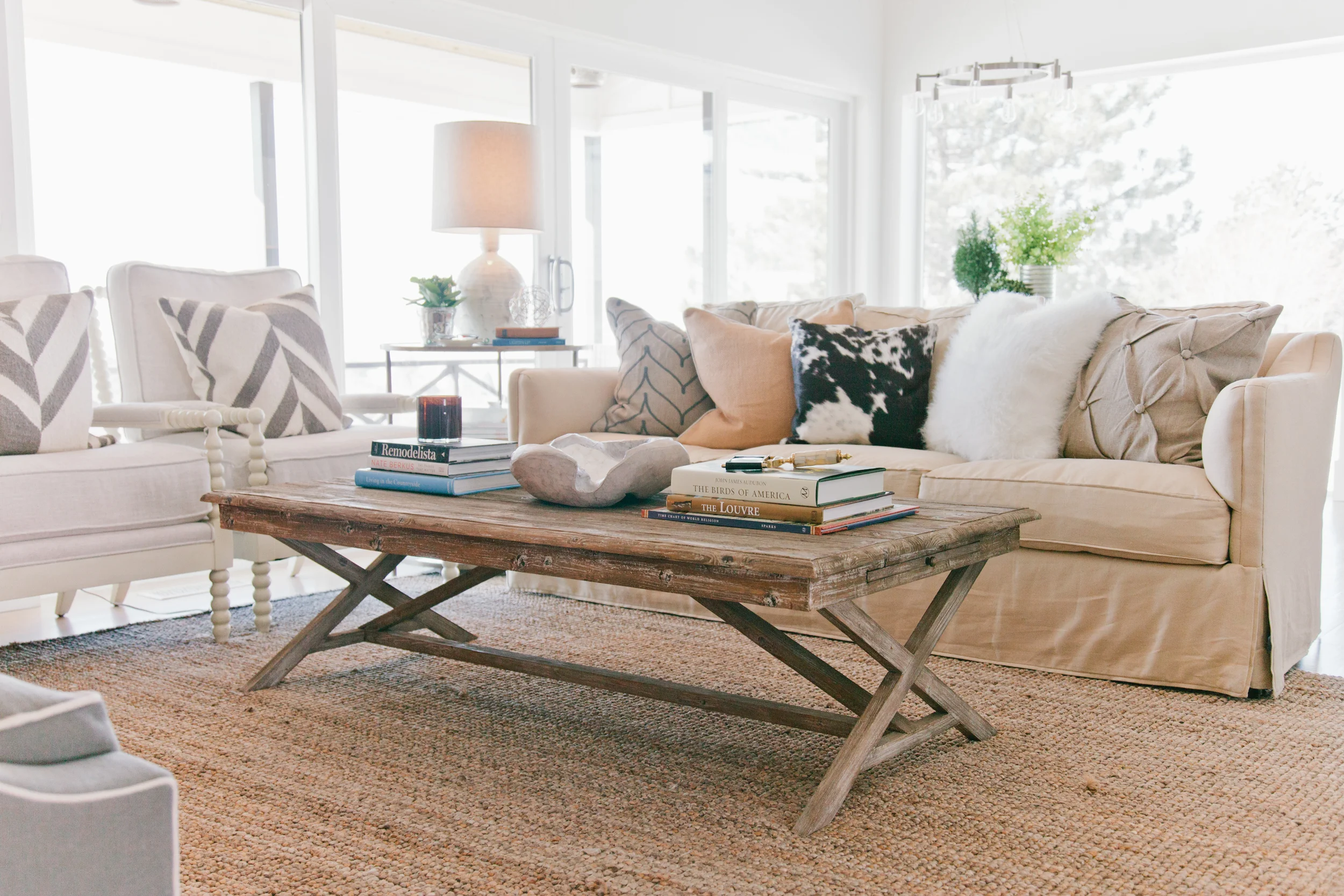 I wanted to create a space with plenty of seating where we could all hang out and enjoy the fire (and the amazing view). Despite the open floor plan, floor to ceiling windows and vaulted ceilings, the space feels quite cozy. I'll reveal a new room in each new post, so as always, stay tuned... Tonya Olsen {photos by Sara Boulter }