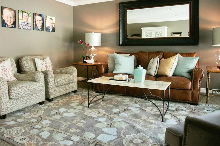 Above: Formal living room AFTER. This furniture was formerly in the basement. The paint color remained the same, but the colors of the furniture, area rug and accessories brighten the room. 