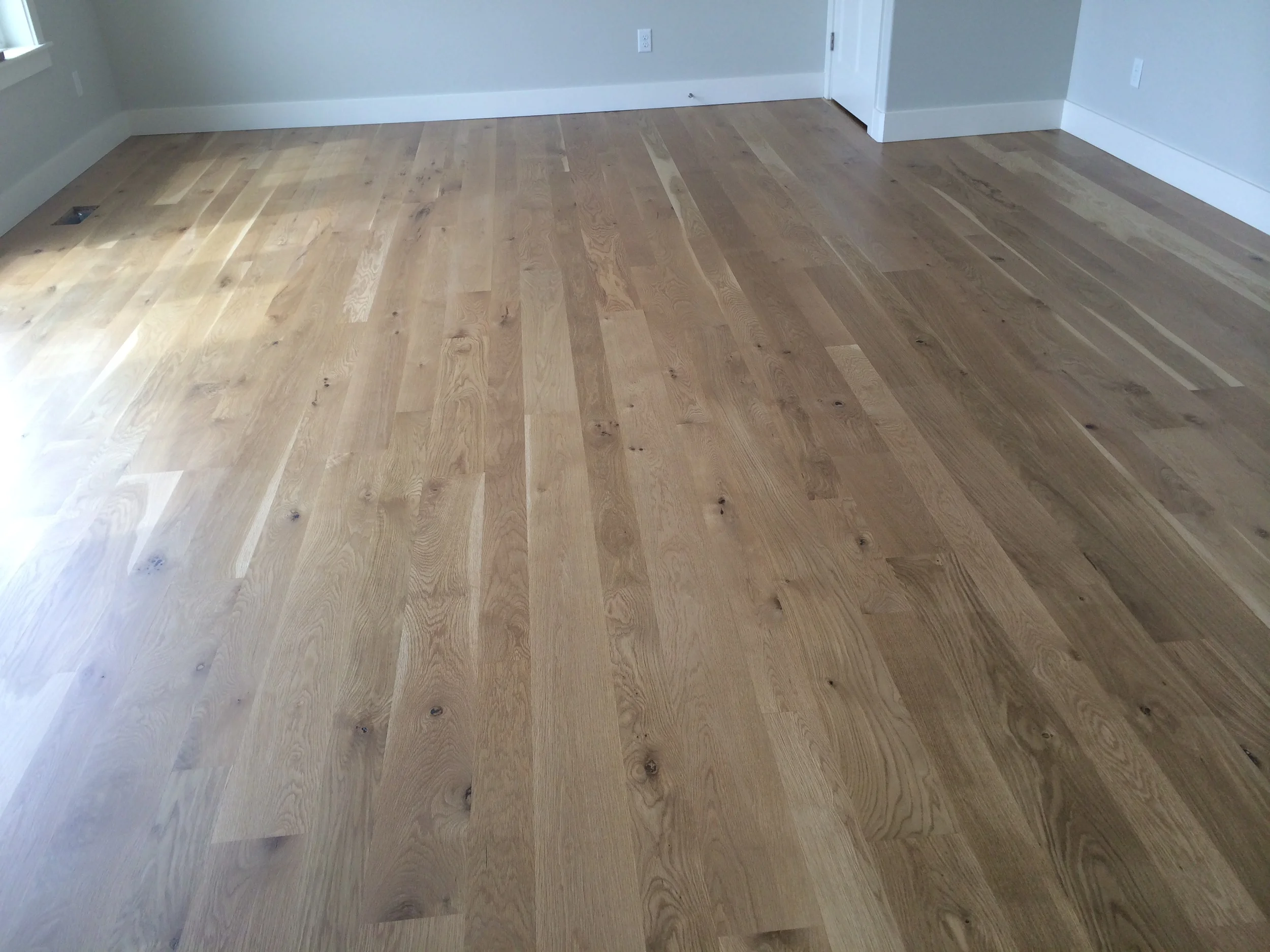 White oak, in 4", 5" and 6" plank sizes, is sealed with a natural finish.