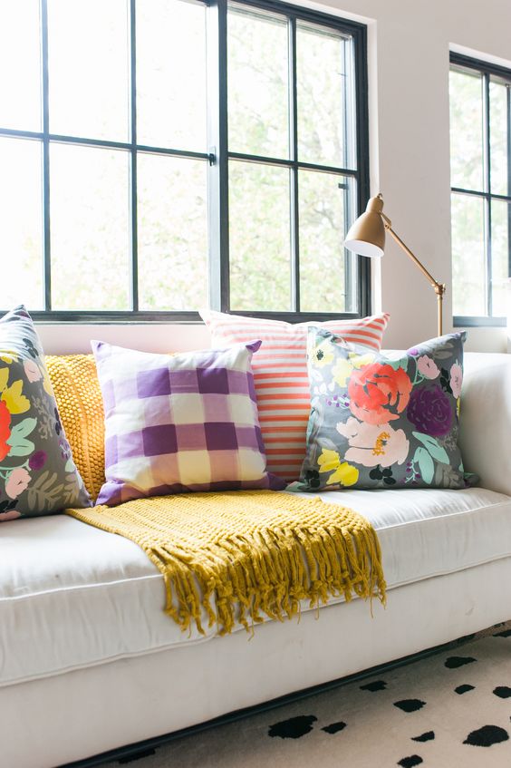 One of our favorite designers, Caitlyn Wilson, masterfully mixed a variety of bright tones to create this fresh and colorful look. The key here is the white background. 