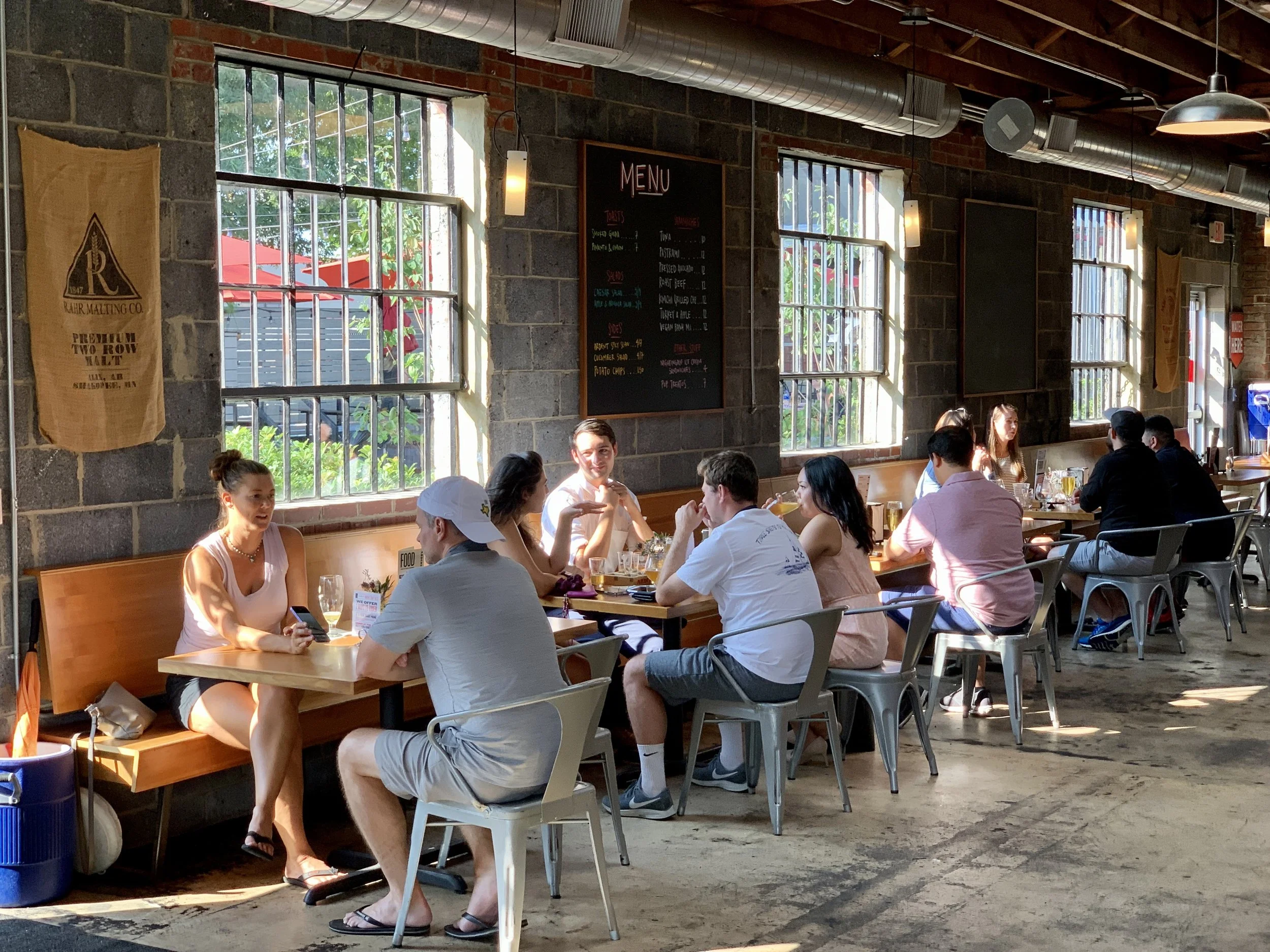 Taproom tables sunny windows.JPG