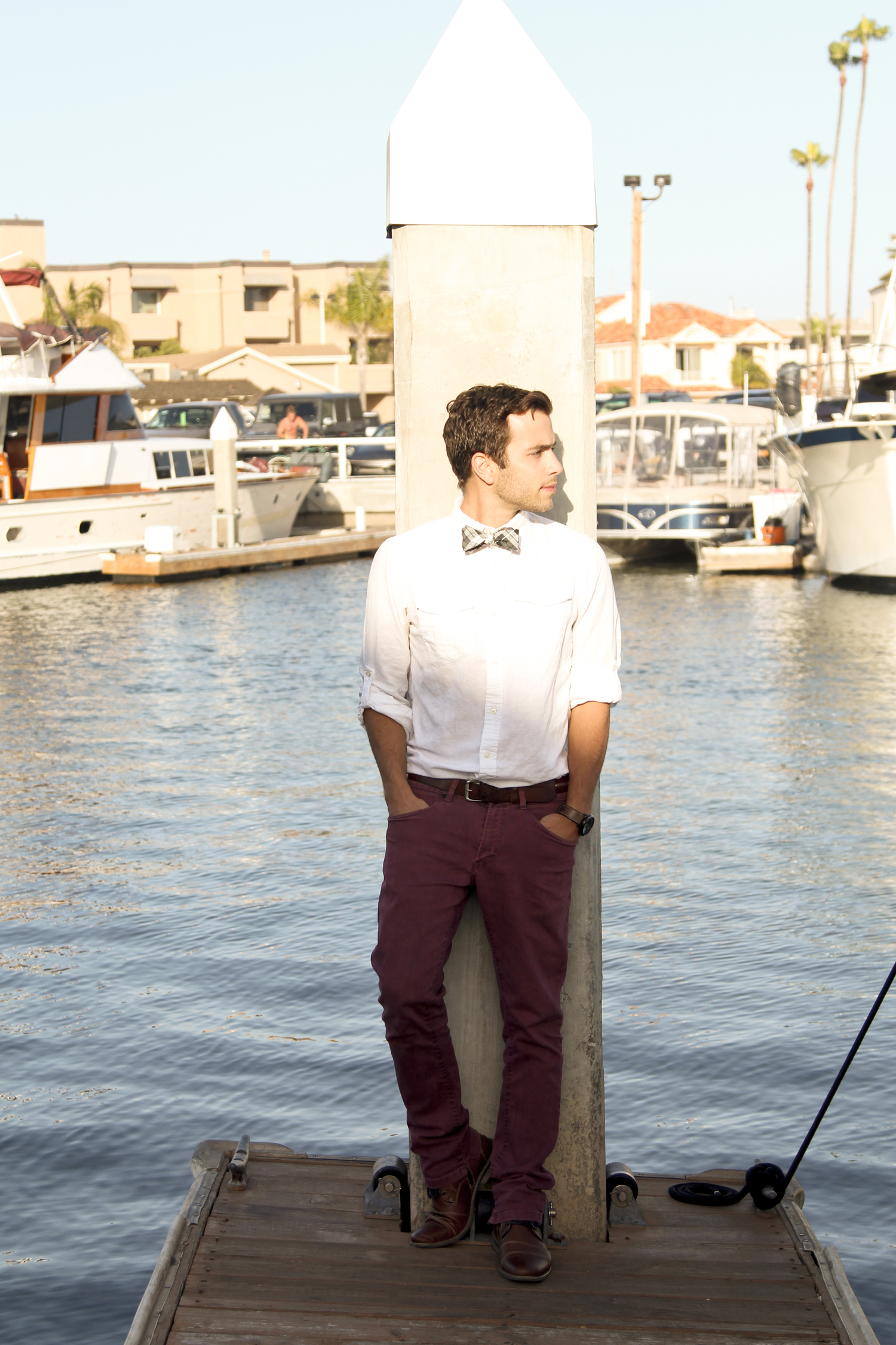  Once again, the white shirt is useful. &nbsp;Notice how the red hues in Nick's pants are paired with the red hues in the bow tie. &nbsp;It creates a visual connection, and the white shirt provides a backdrop. &nbsp;For those wanting to wear a bow ti