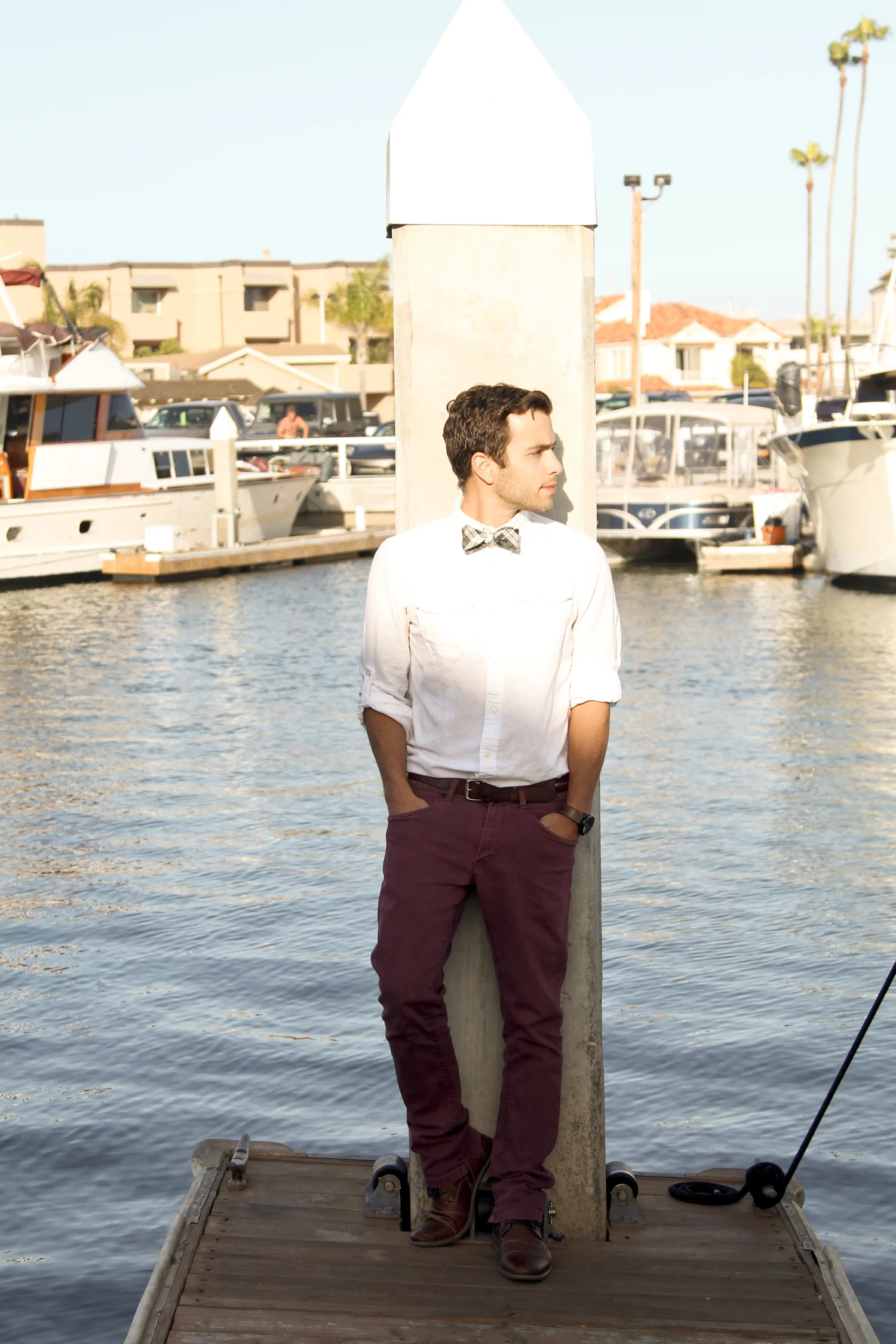 Once again, the white shirt is useful. Notice how the red hues in Nick's pants are paired with the red hues in the bow tie. It creates a visual connection, and the white shirt provides a backdrop. For those wanting to wear a bow tie with pants of a different color, take a cue from this look.