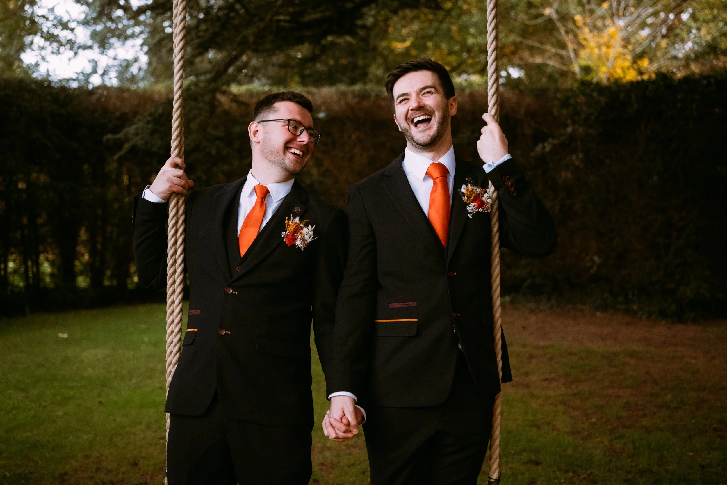 Happy groom and groom on a swing