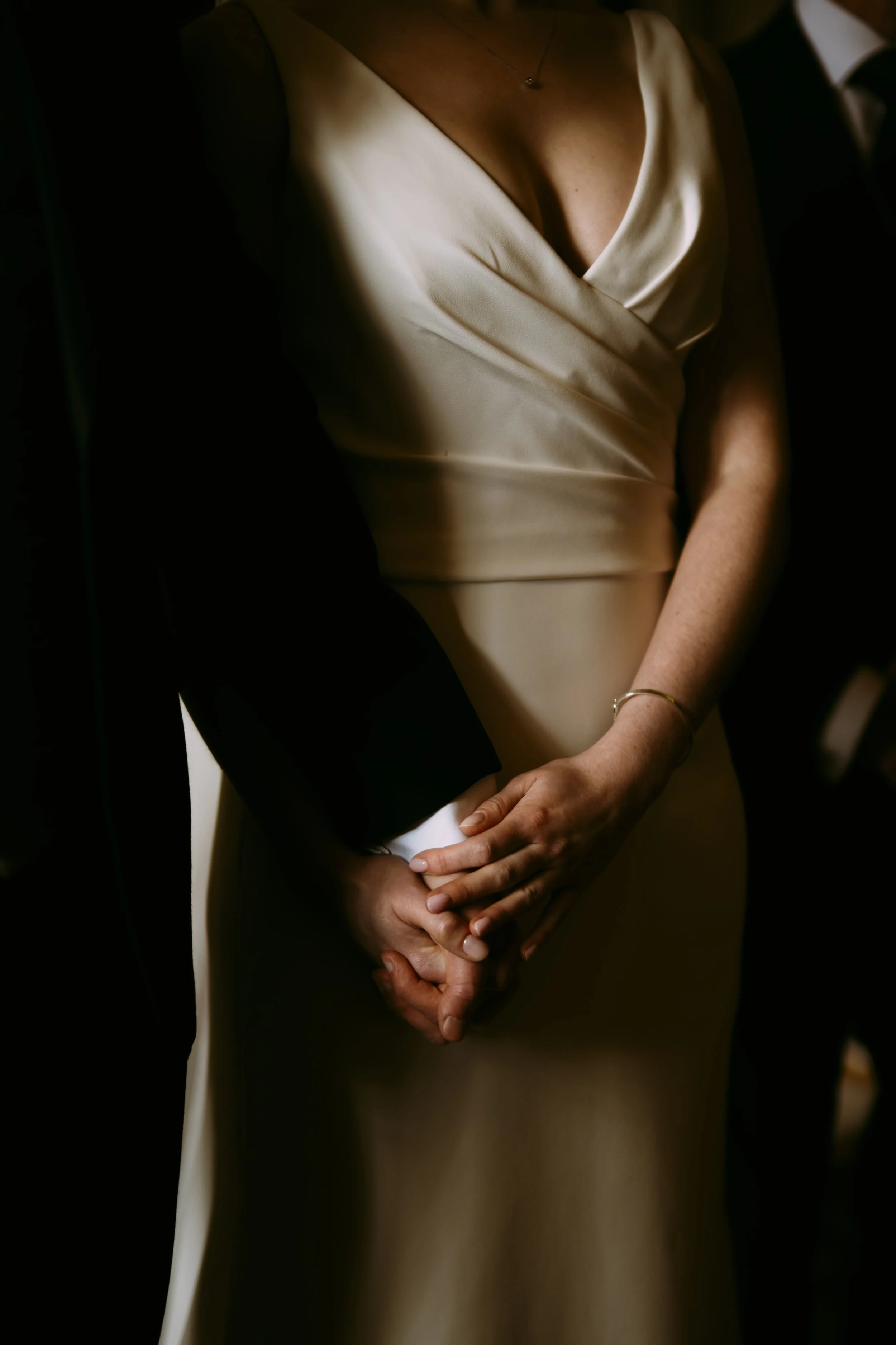 Bride and groom holding hand during the ceremony