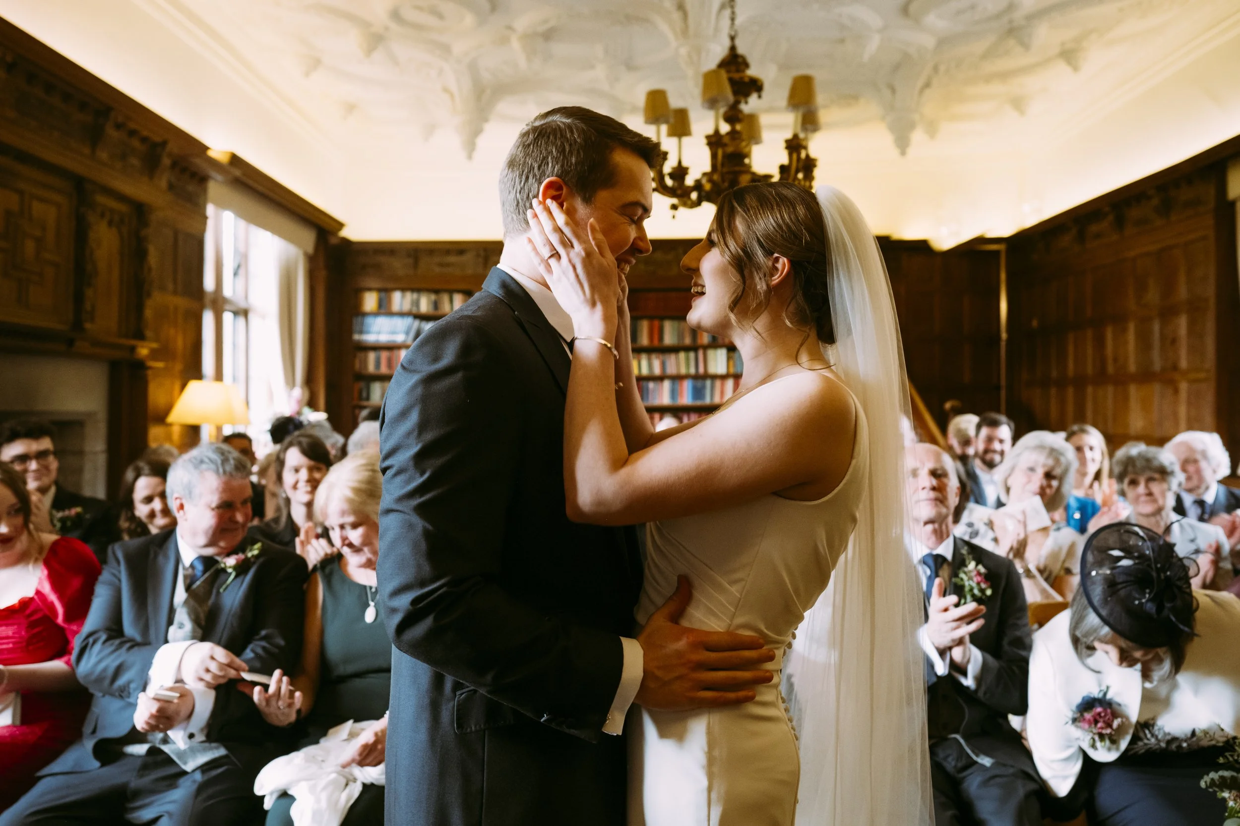Wedding ceremony inside the library at Brinsop Court
