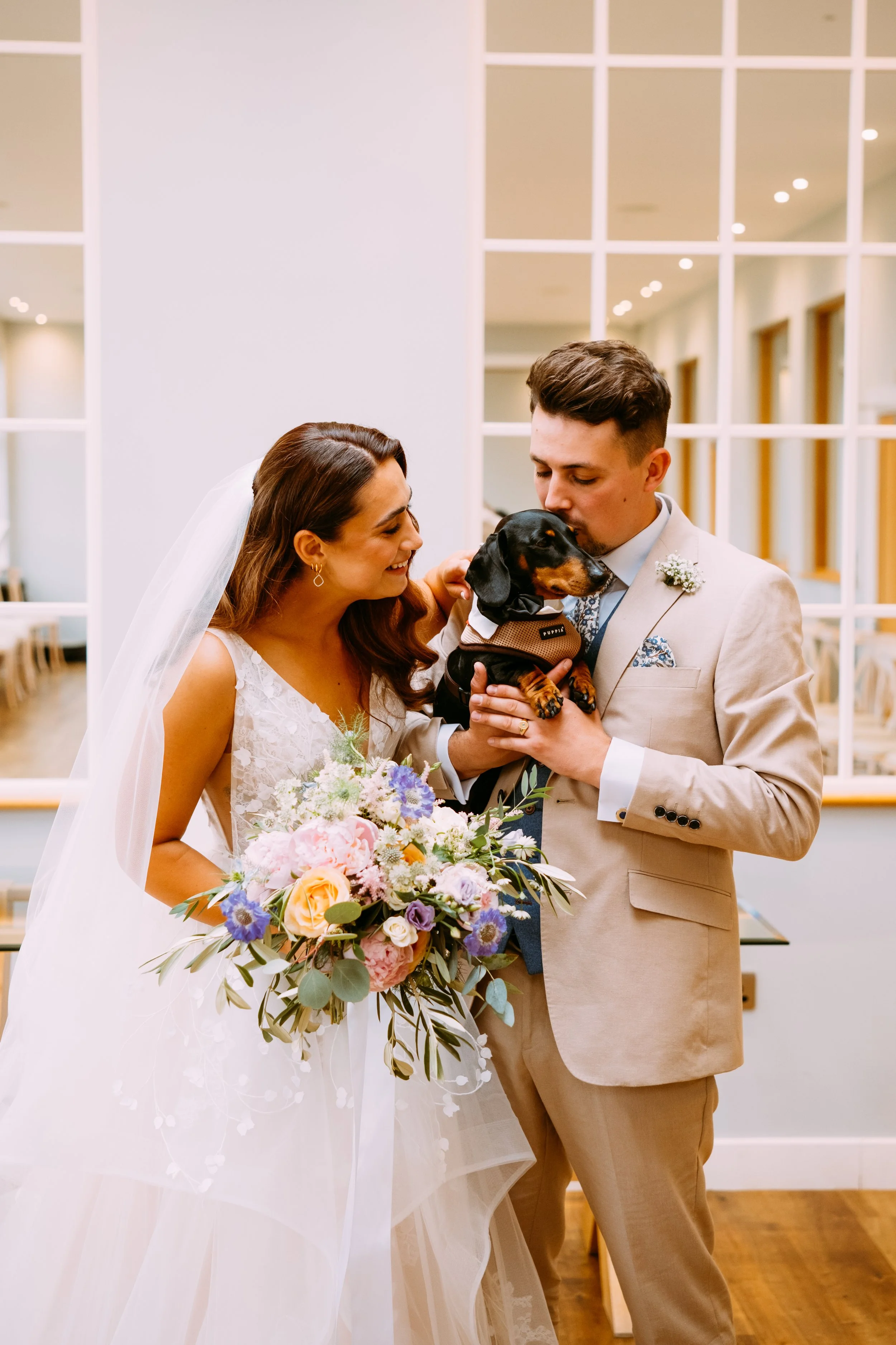 Bride and groom portrait with their dog