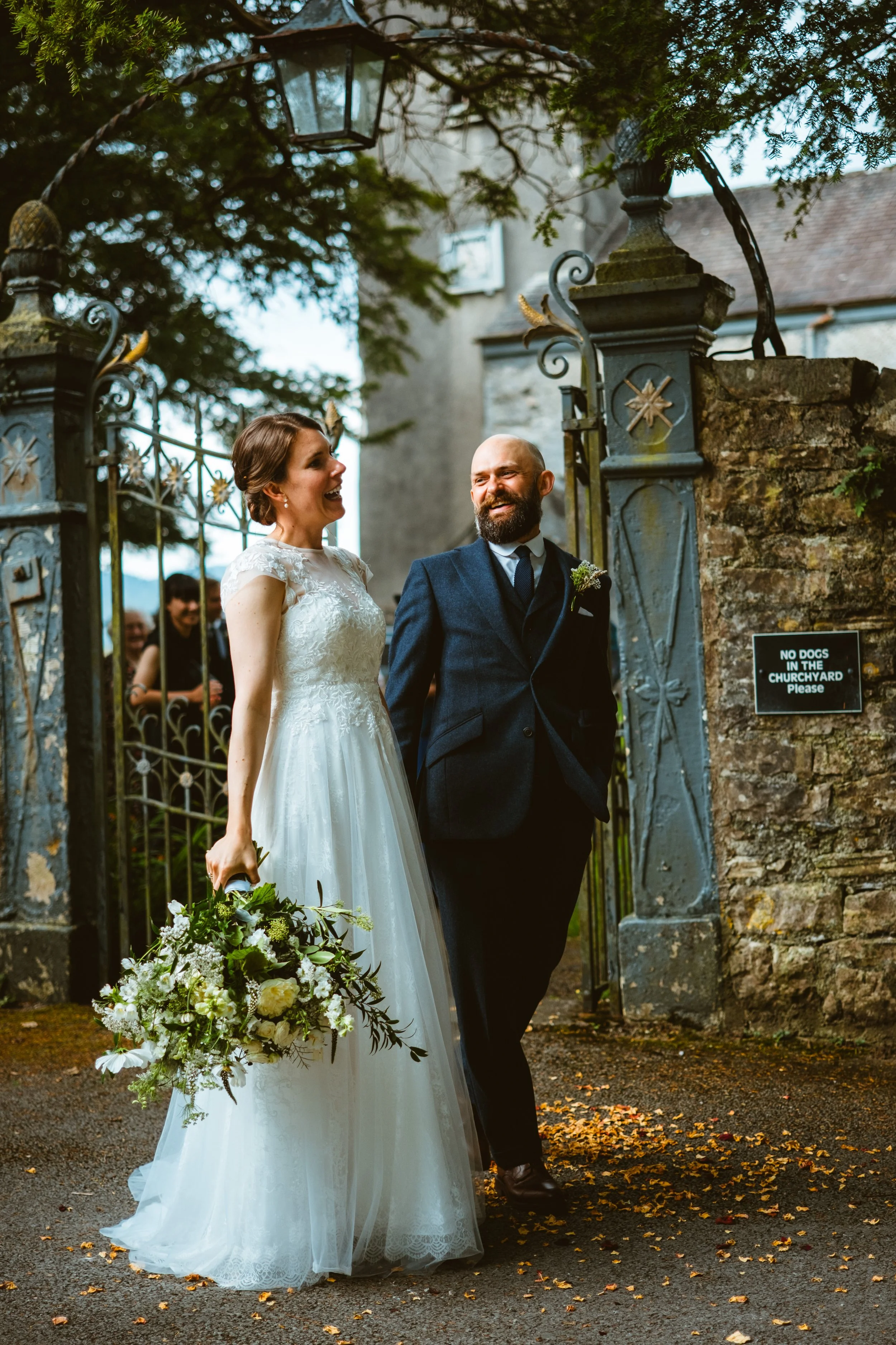 Happy bride and groom leaving the church