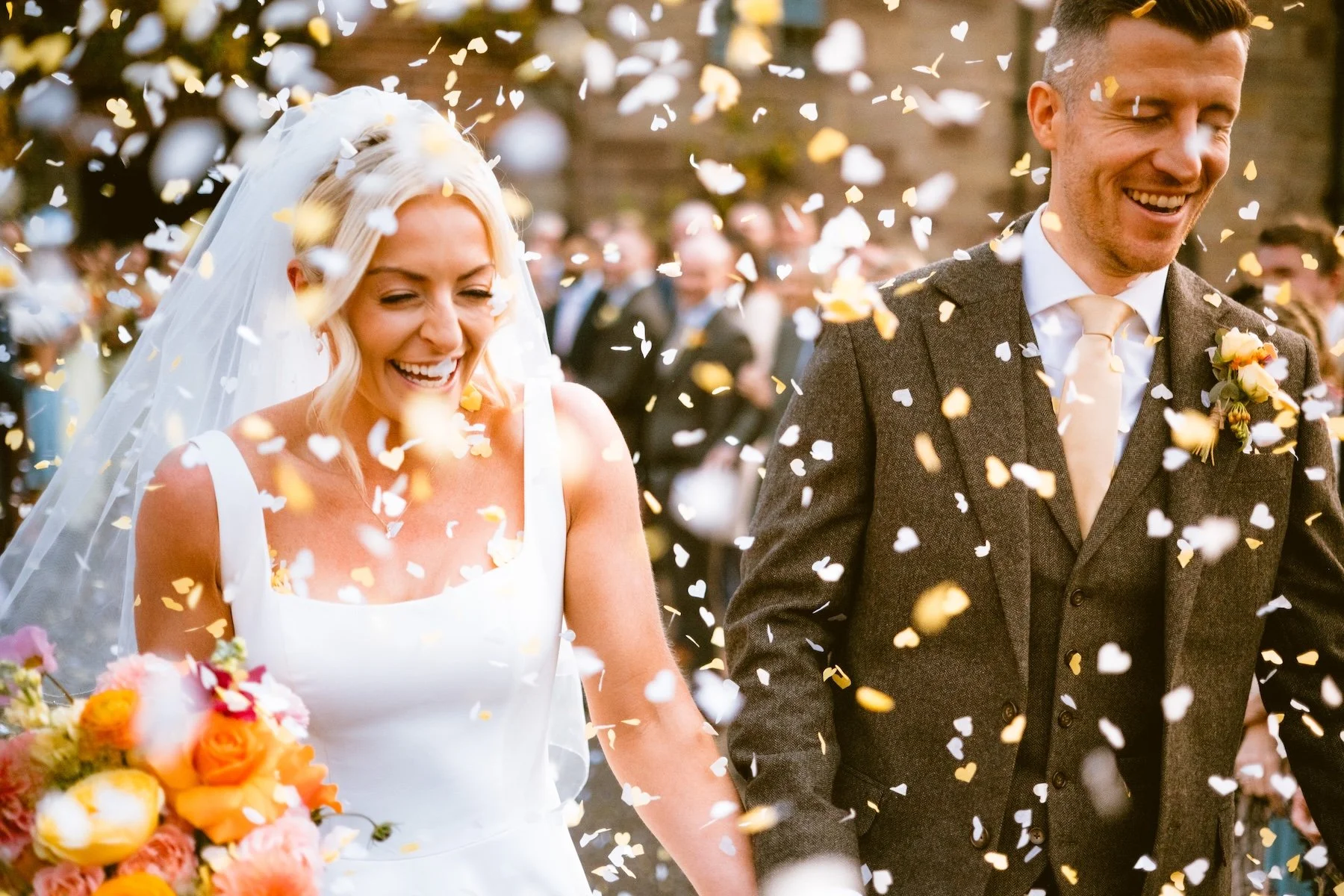 Bride and groom doing confetti at Brinsop Court
