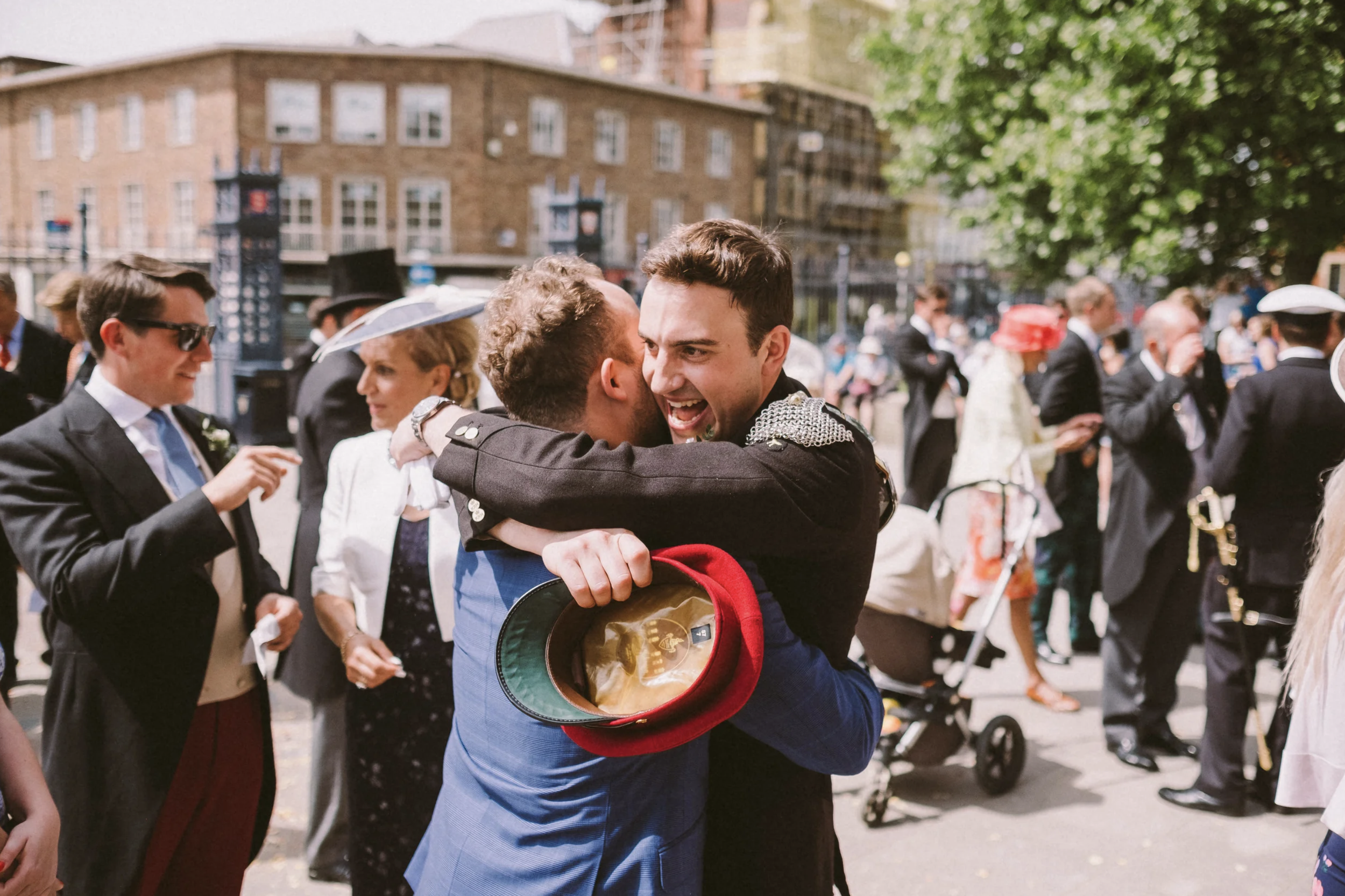 Groom hugging a wedding guest