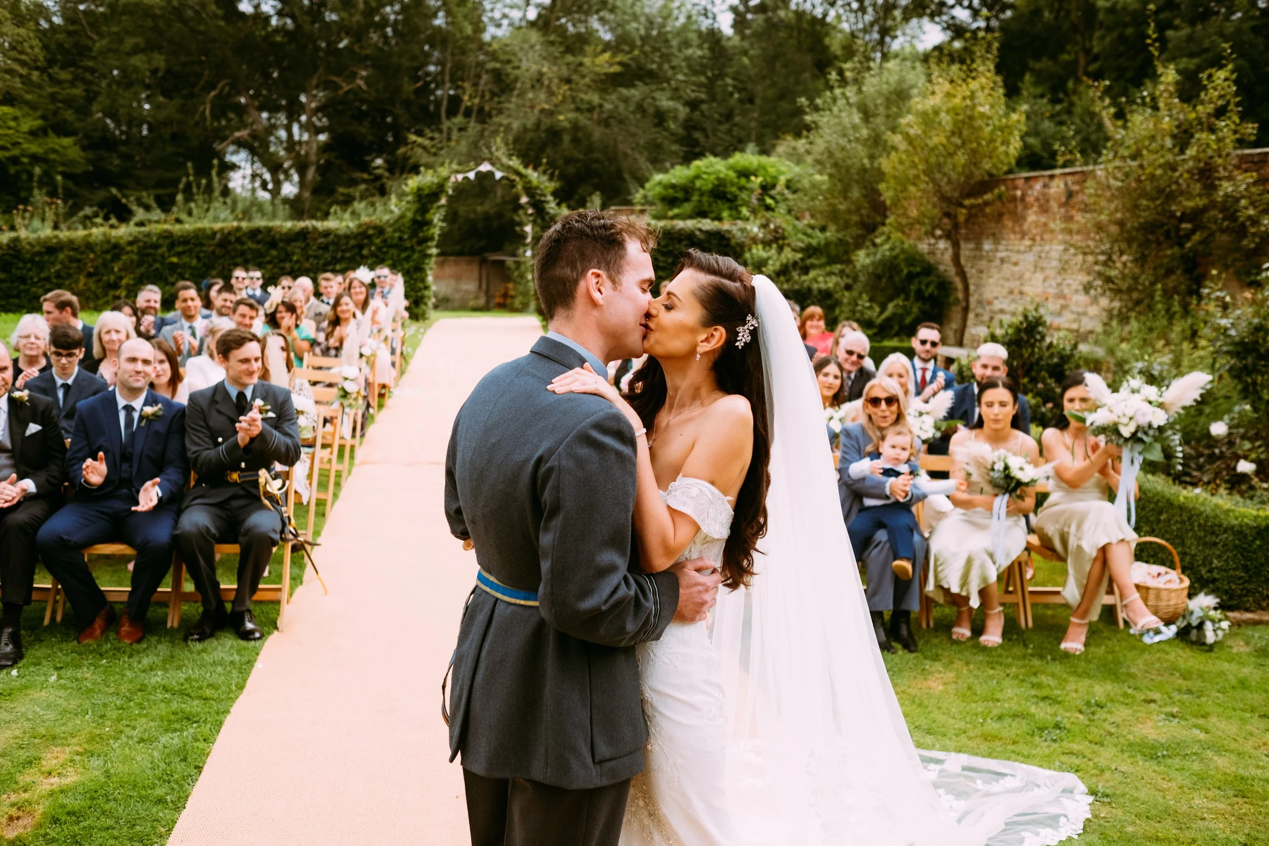 Bride and groom having a first kiss