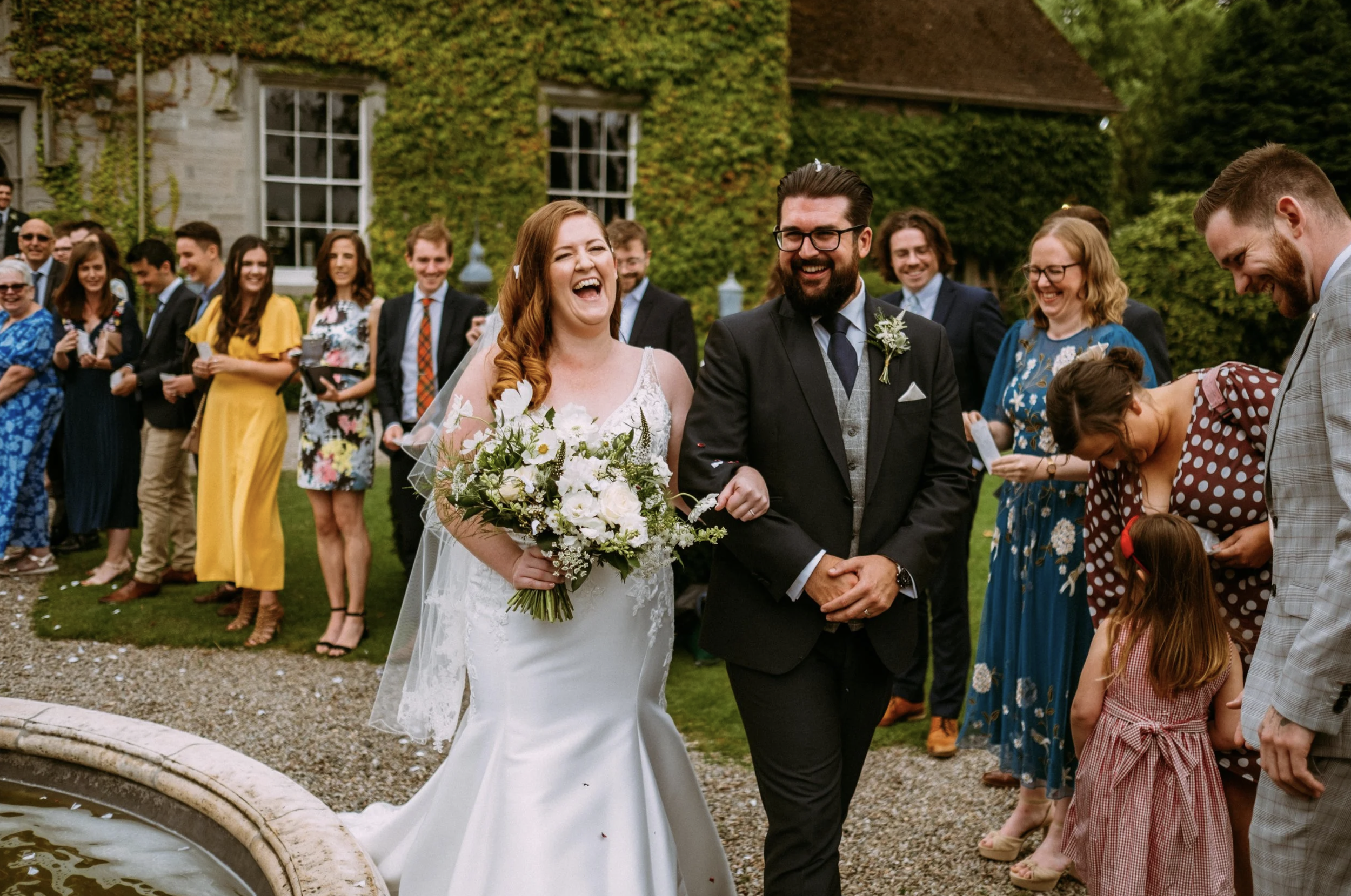 Happy bride and groom walking along