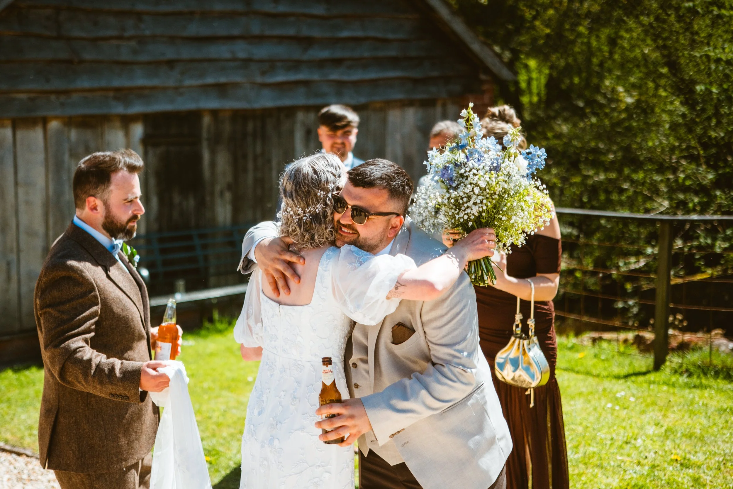 Wedding guest hugging the bride