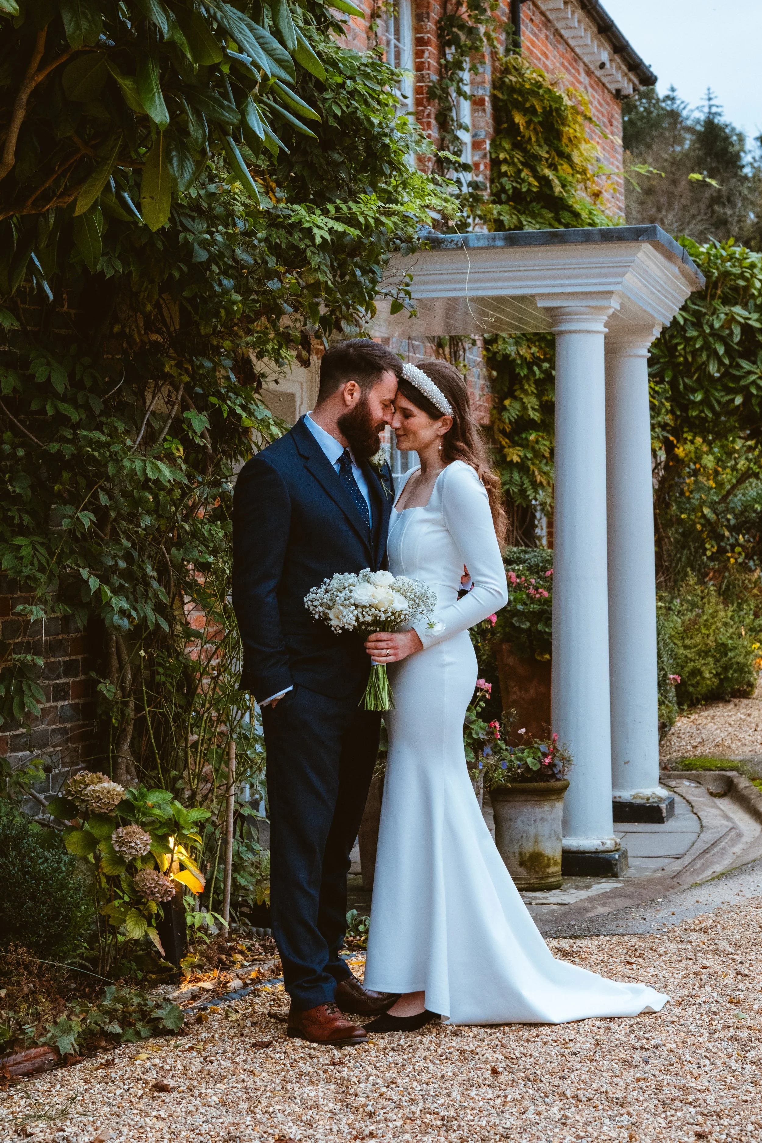 Relaxed wedding portrait of a newly married couple outside at Syrencot