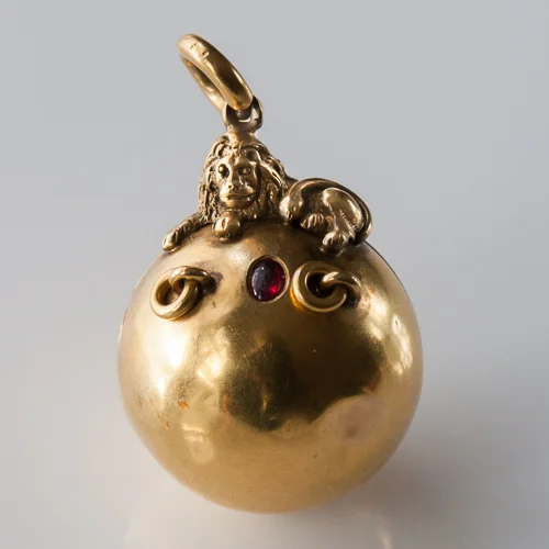 Gold Orb Charm with Lion and Red Stone