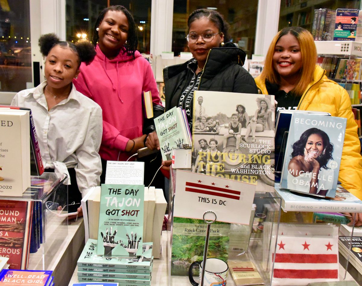 A uthors posed for photos next to their book -- on display alongside Michelle Obama's autobiography , Becoming!