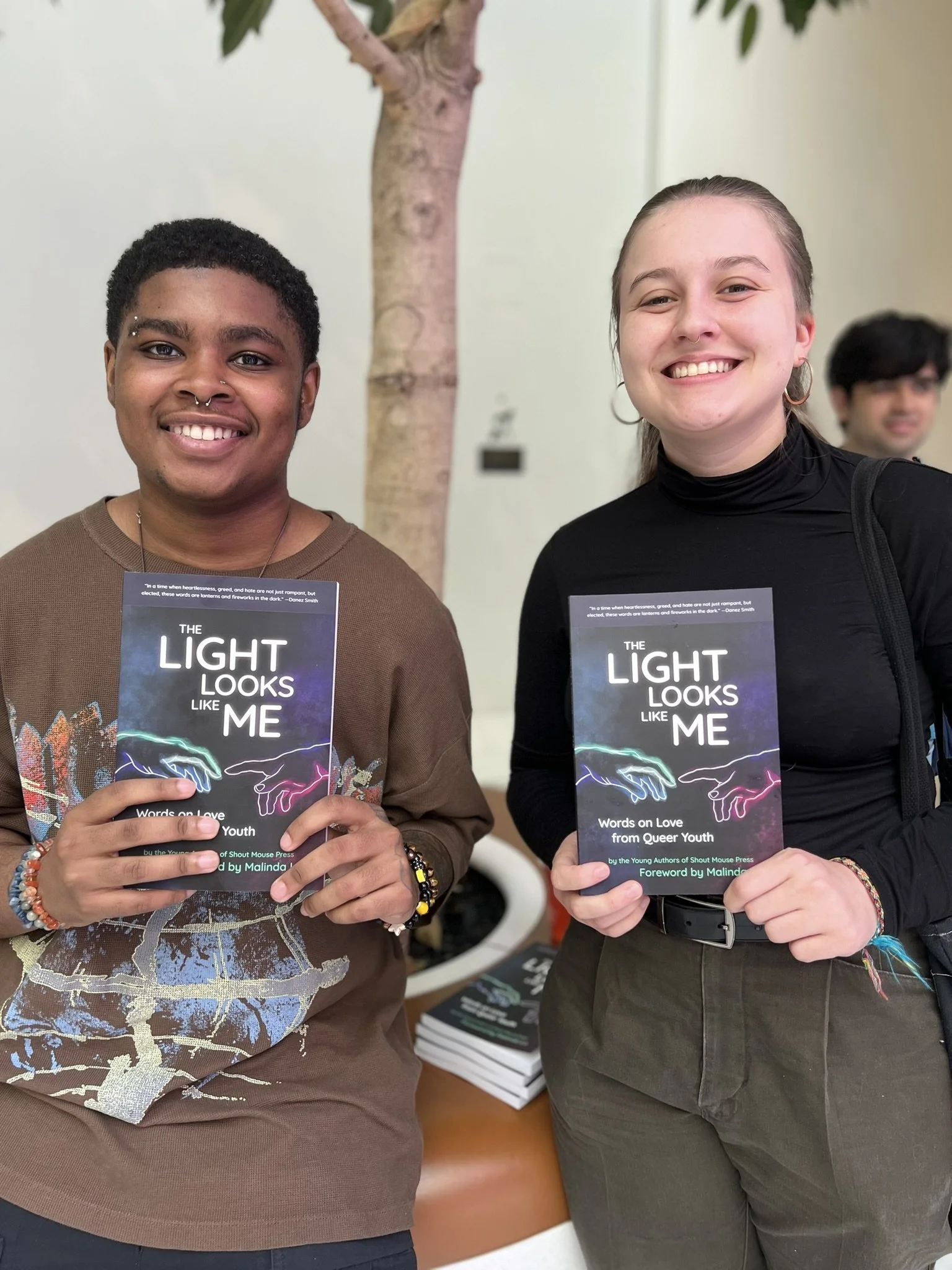 authors holding book for first time.jpeg