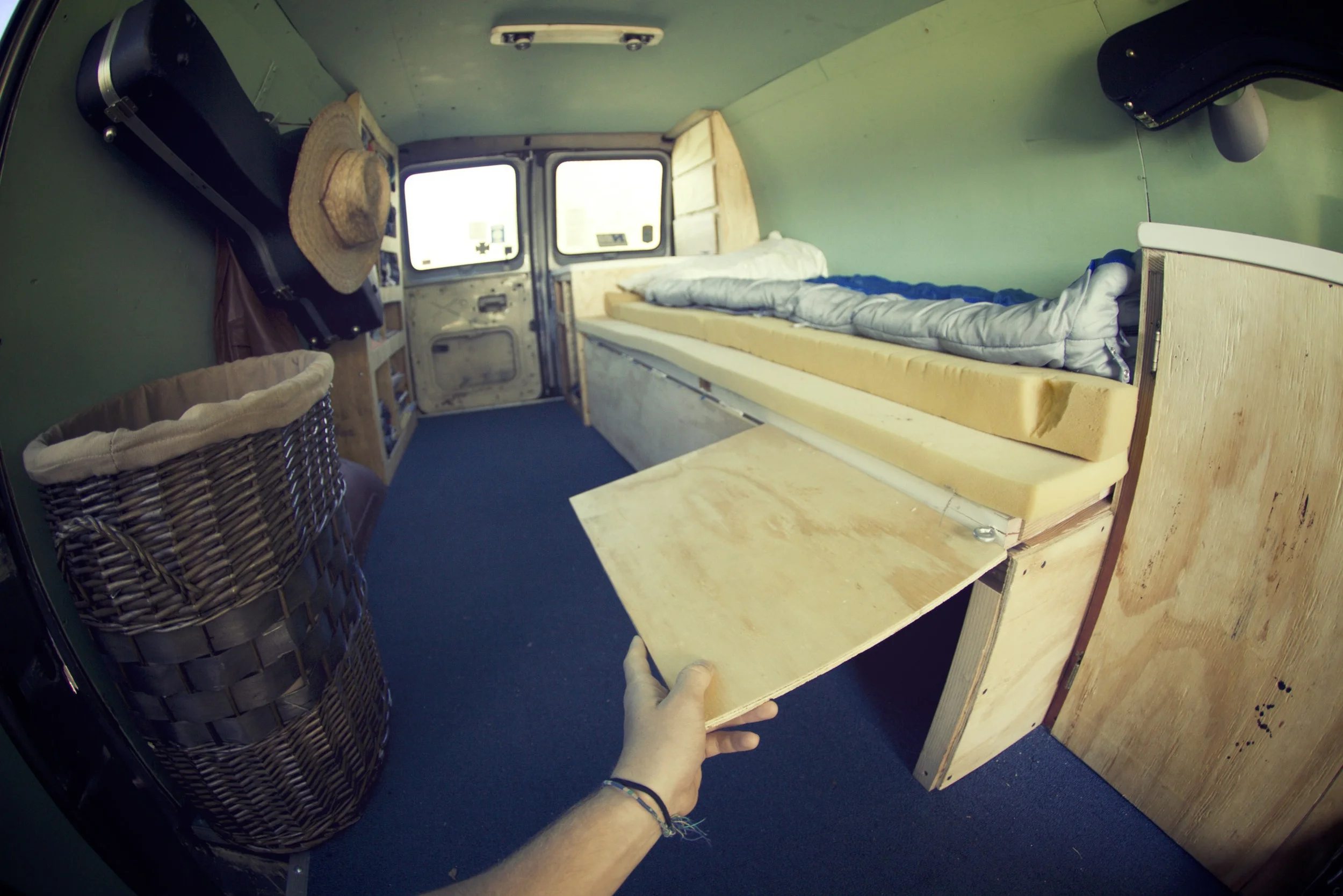 There are three boxes that slide out from under the bed. We built three little doors to access them. 