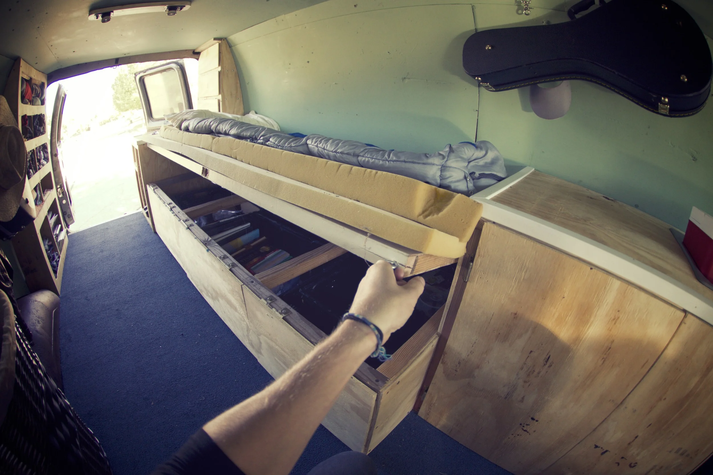 The bed is build out of a repurposed door from the house I grew up in. We even used the original hinges to mount it to the Port side interior. We built it this way as a second point of access to the storage underneath. So pumped on this. 