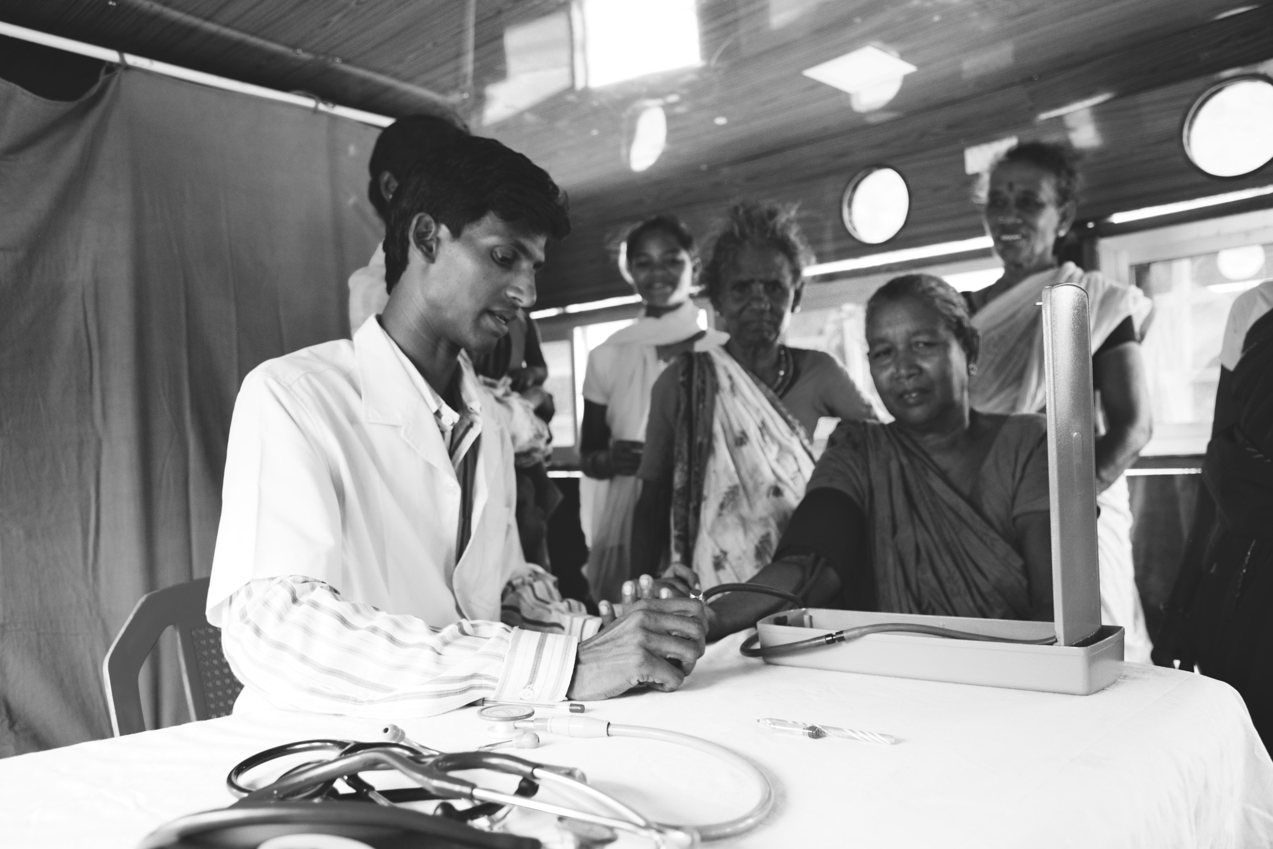 A young doctor helping patients on the medical boat we took to remote villages. 