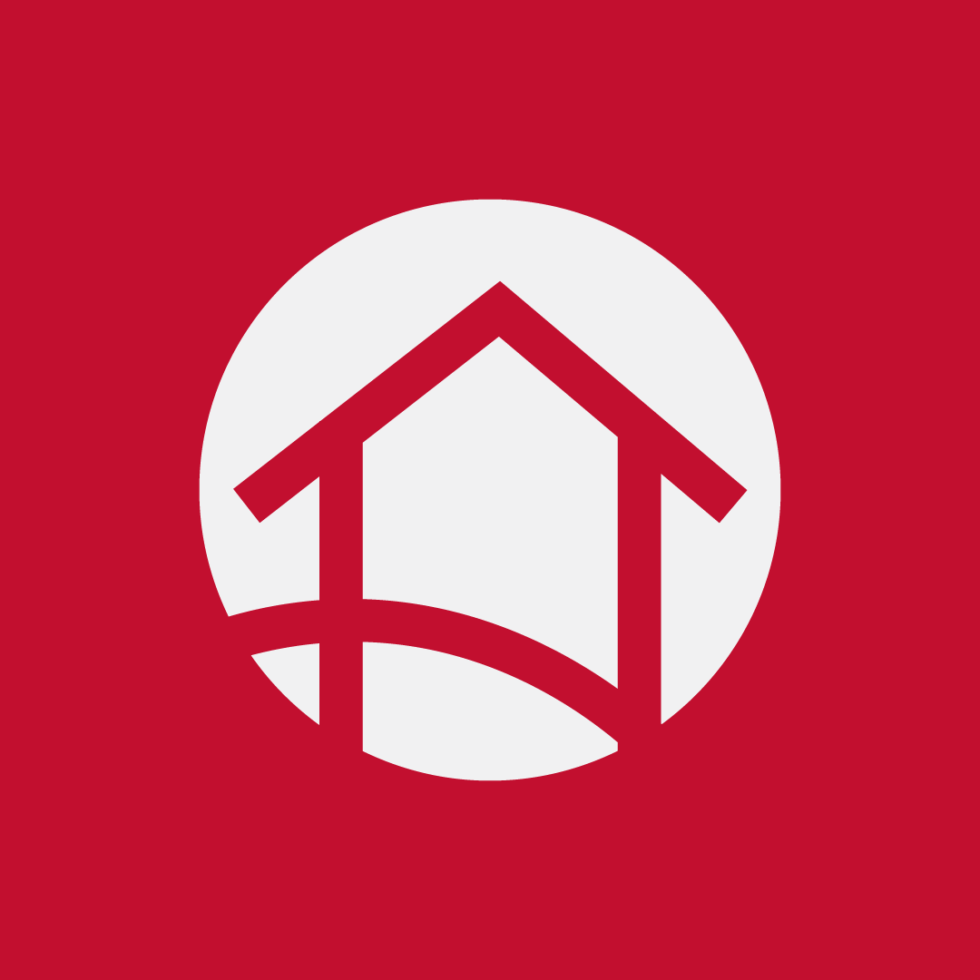 Logo with a red background and a white circle containing a stylized red house with a curved path underneath.