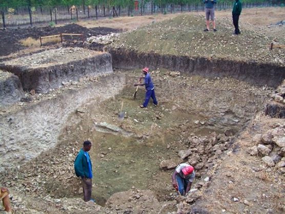 Foundation being dug, with room for water storage below the house.