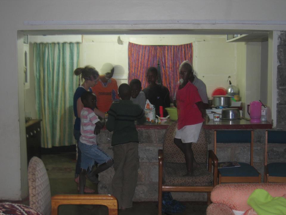  Boys gather at night in the kitchen 