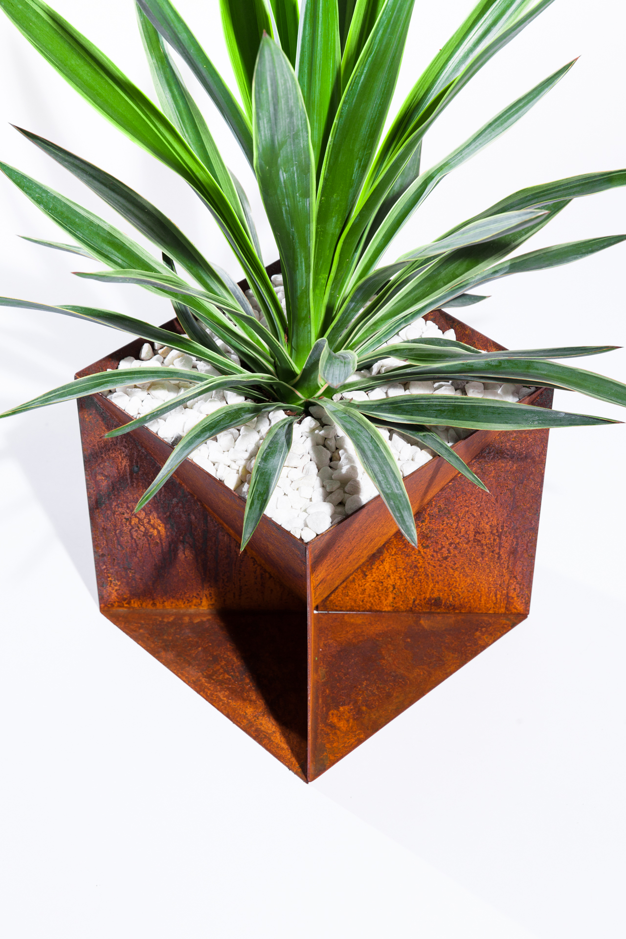 The Weathering Steel Origami Planter is an outdoor planter by Trey Jones Studio