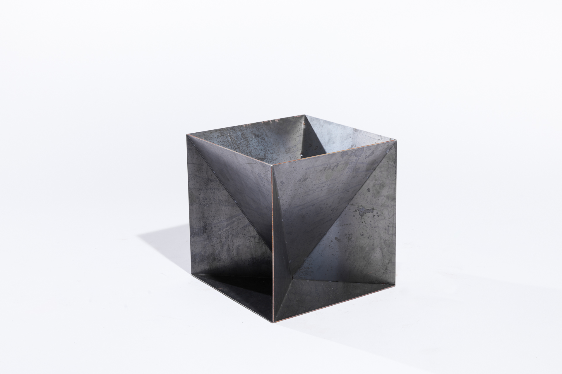 The Weathering Steel Origami Planter is an outdoor planter by Trey Jones Studio