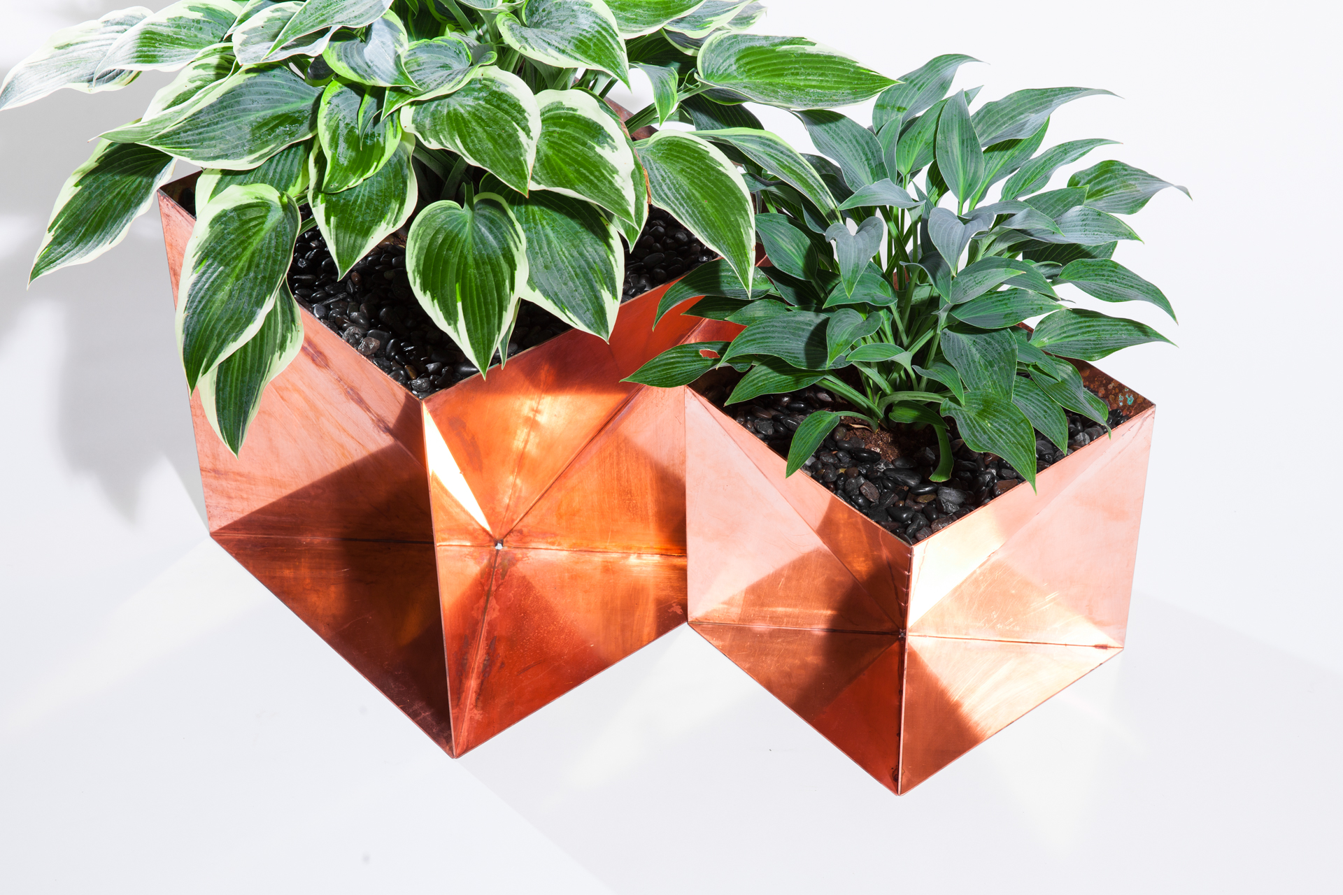 The Copper Origami Planter is an outdoor planter by Trey Jones Studio