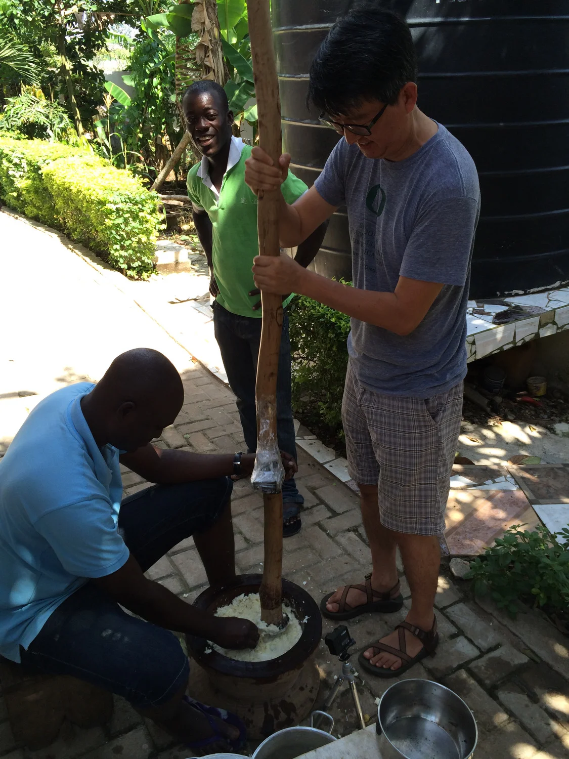 My short lived fufu pounding experience. I was hungry and didn't want to wait that long so I let one of the experienced guys take over.