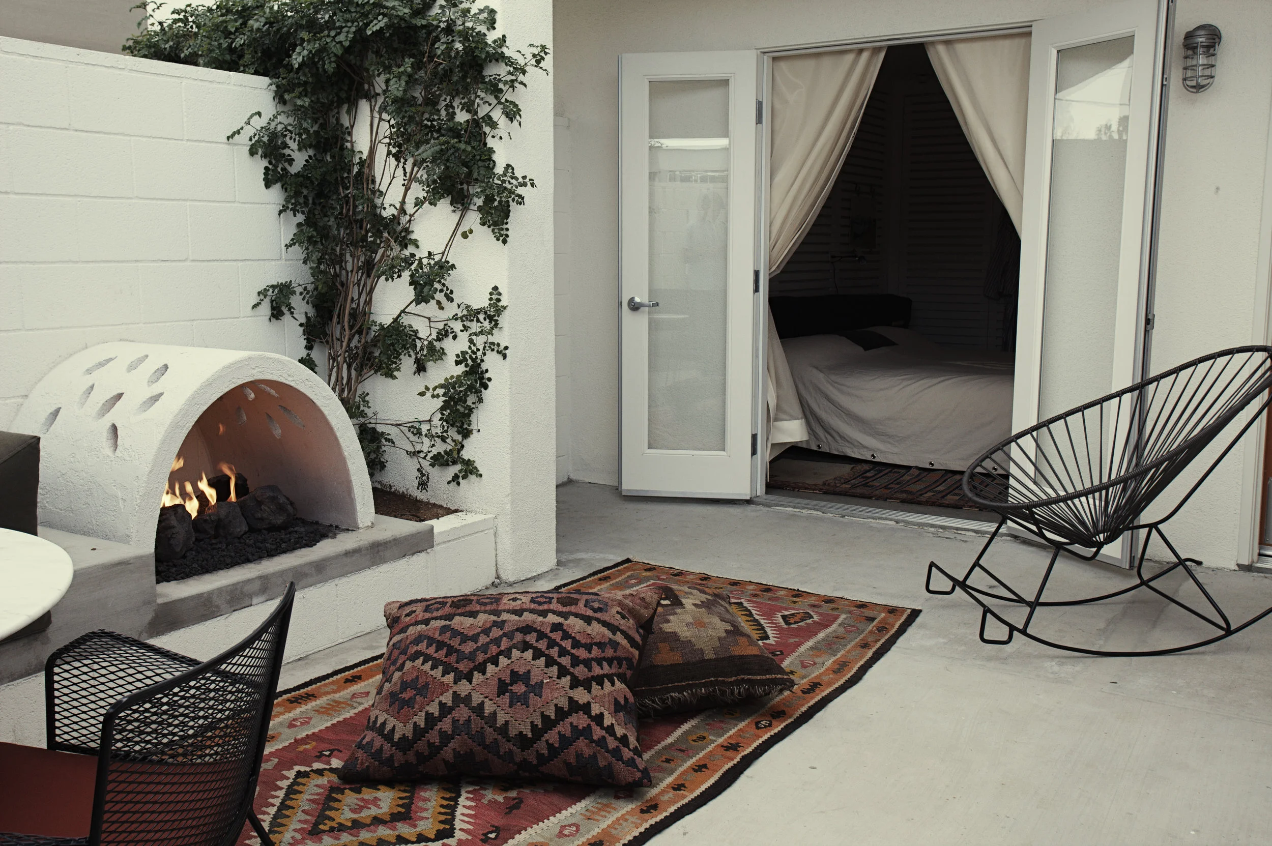 Some rooms offer patio areas with a fireplace like this one. 