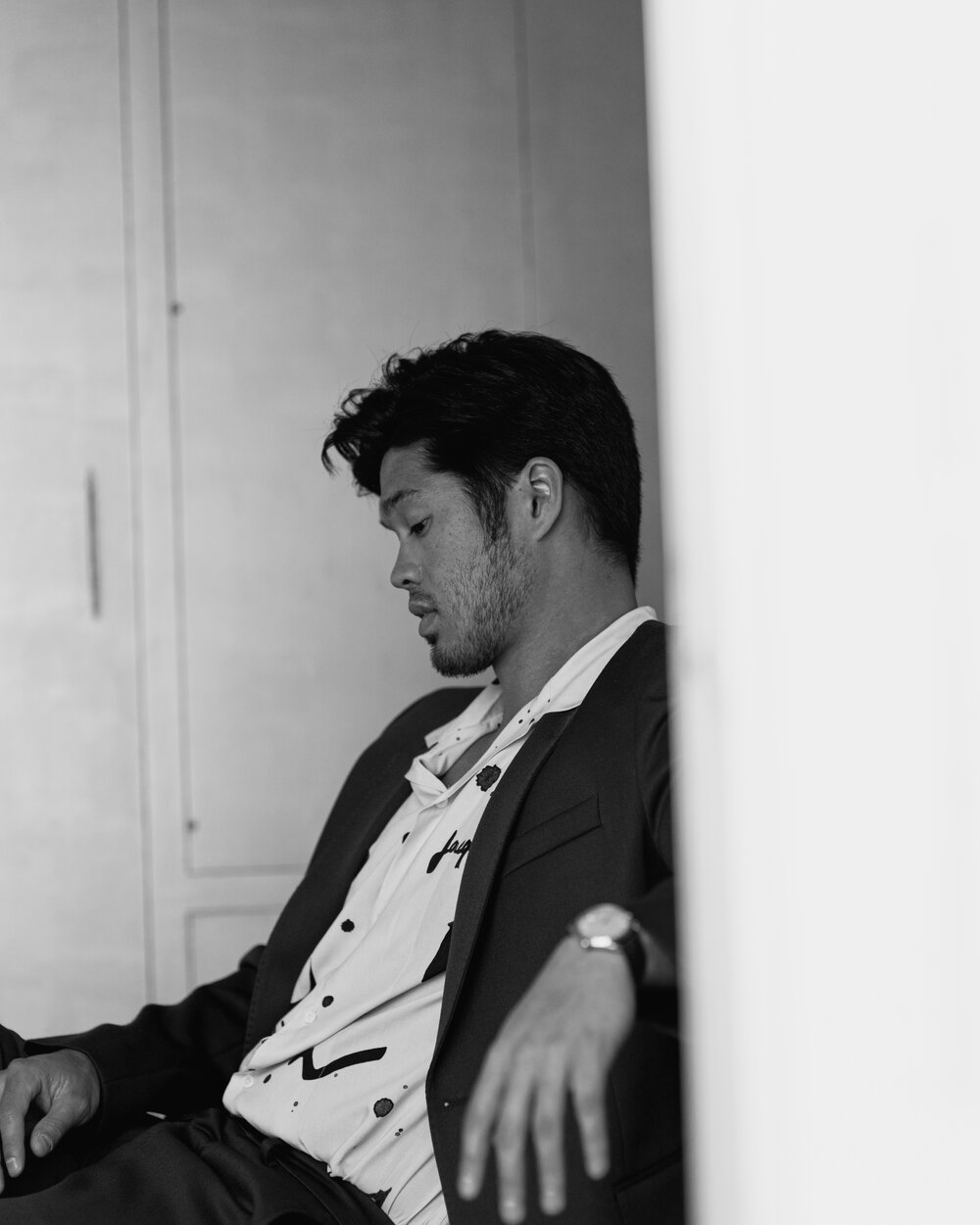 AMI PARIS suit available at OPTIMIST LA, JACQUEMUS shirt available at FWRD MAN, OMEGA watch