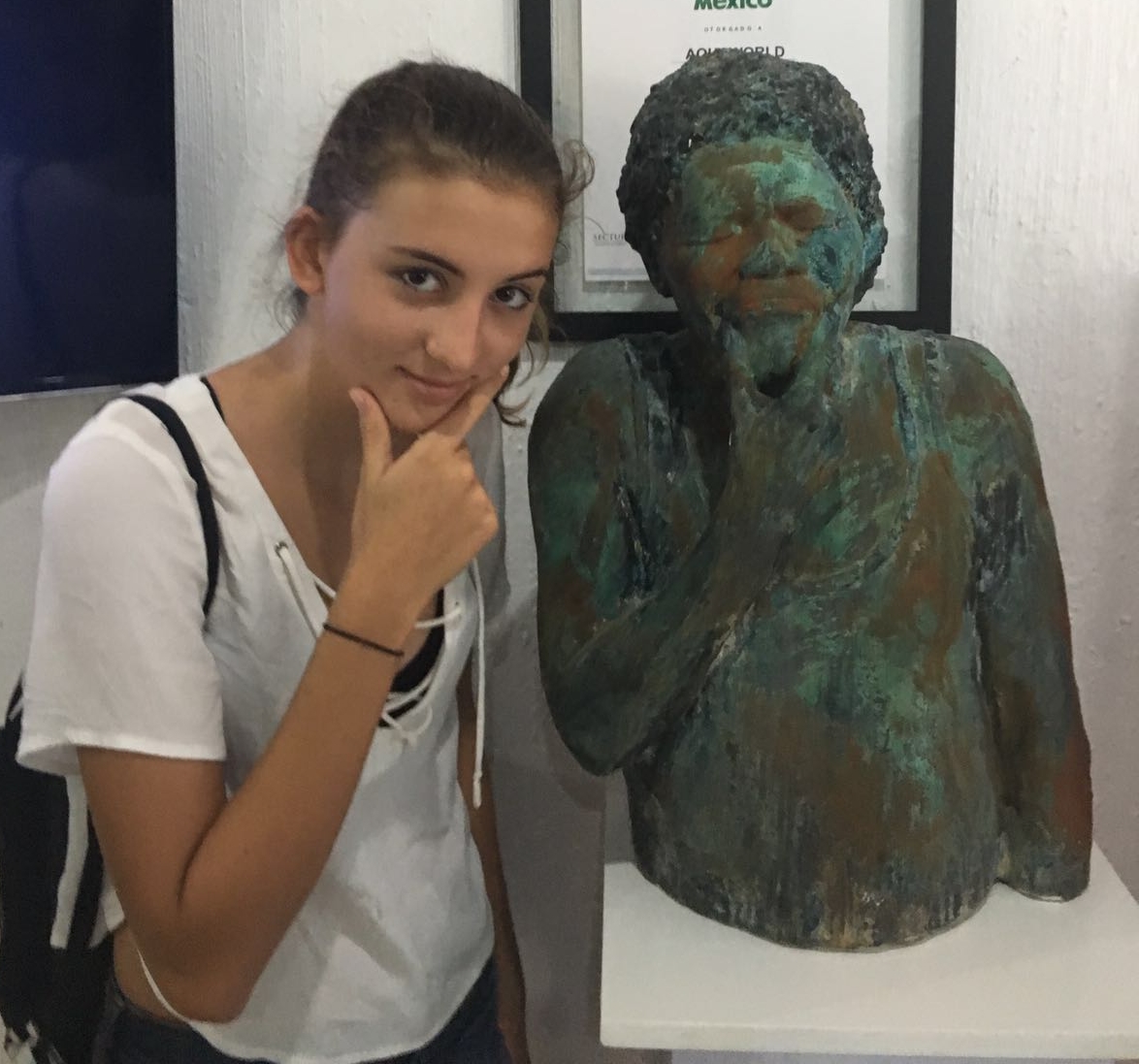 Maya with one of the statues they will see on their underwater museum tour