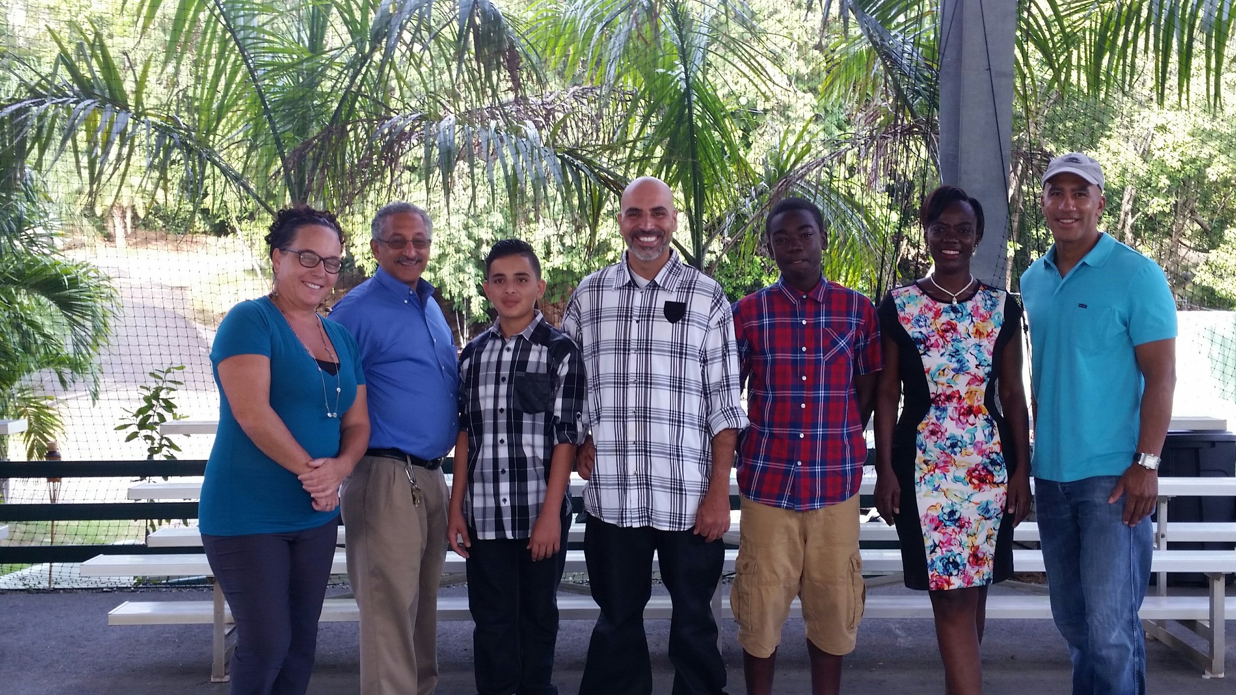 Gloria Zakers-Director of PGIA, Michael Bornn- Head of School, Jamil Kareem- 9th grader, Eisa Jamil- Parent, Karl Dinang-10th grader, Annette Dinang -parent, and Bill Perkins, CEO of BrisaMax Holdings.