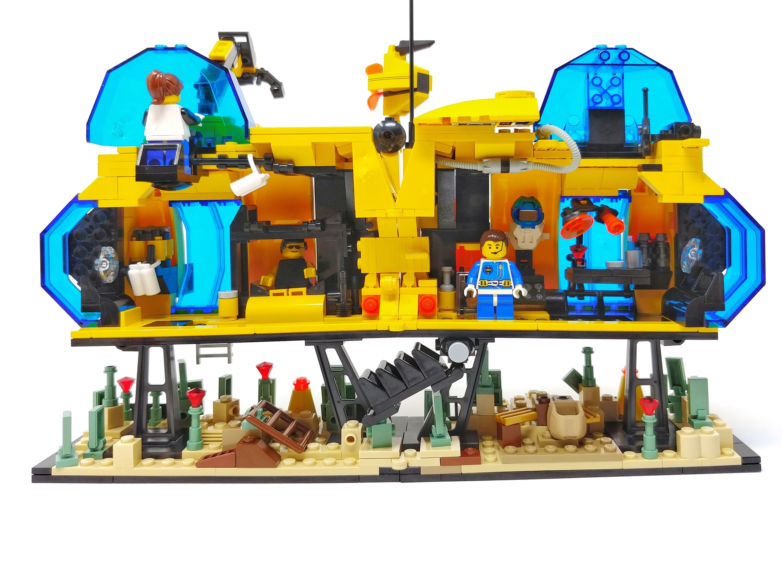 The base can fold fully "flat." The exterior features a hydro turbine, satellite dish and crane. The interior features crew and research quarters. The airlock doubles as a hallway in this configuration.